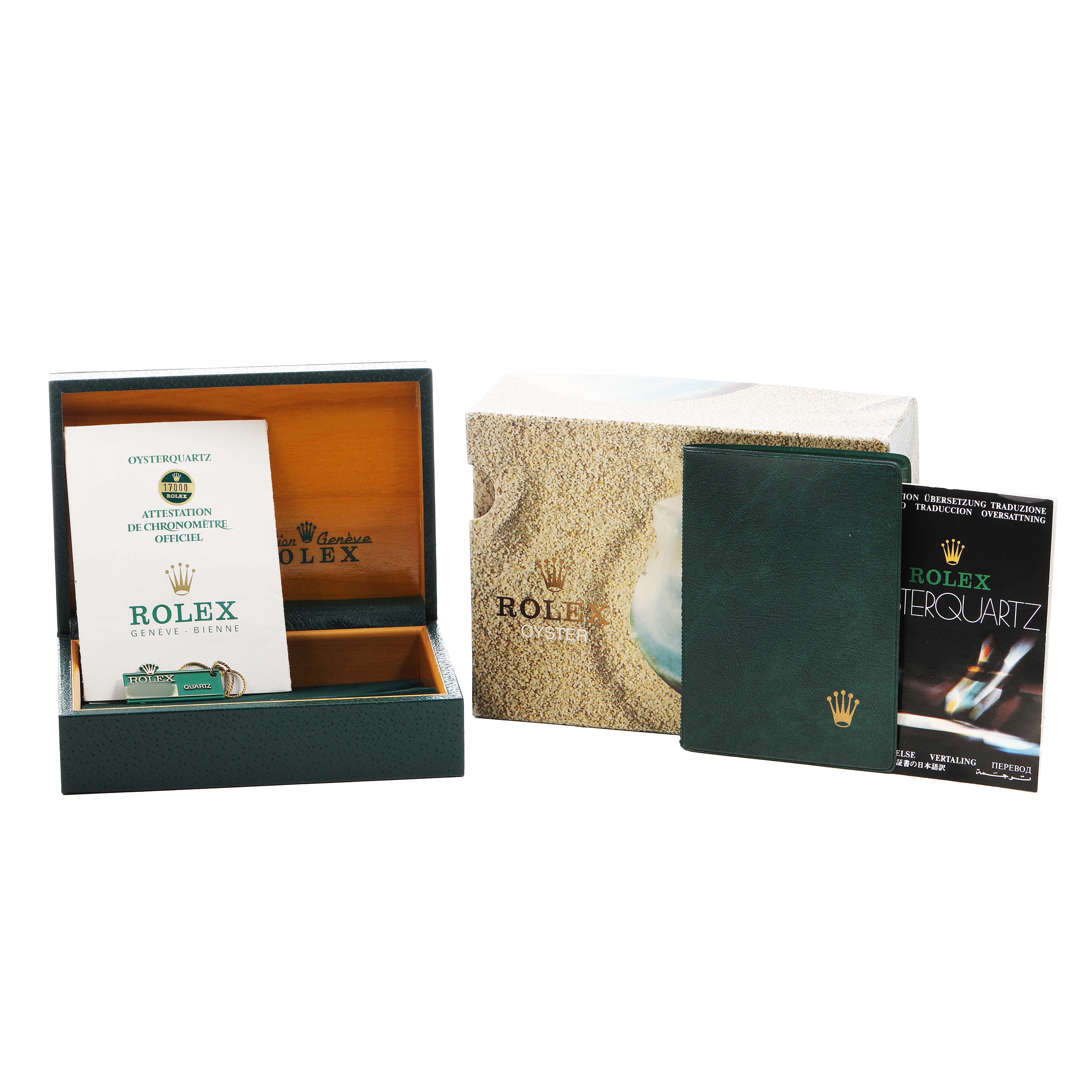 The image shows the Rolex Oysterquartz 17000 Men's Stainless Steel White Dial packaging, including a box, papers, and a booklet, all shot from a front angle.