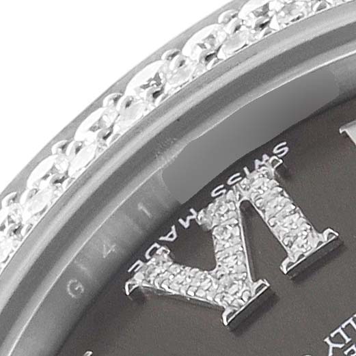 This close-up image shows a portion of the bezel and diamond-set Roman numeral hour marker of the Rolex Pearlmaster 81339 Women's White Gold Brown Dial 81339 Women's White Gold Brown Dial watch.