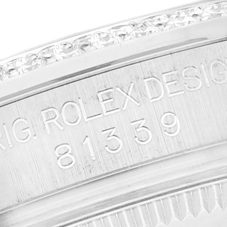 The image shows a close-up of the engraved case side of a Rolex Pearlmaster 81339 Women's White Gold Brown Dial 81339 Women's White Gold Brown Dial watch, featuring the model number and design details.