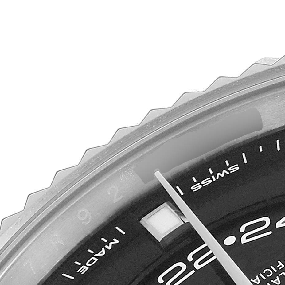 This image shows a close-up of the dial, bezel, and hour markers of a Rolex Sky-Dweller 326934 Men's Stainless Steel Black Dial 326934 Men's Stainless Steel Black Dial watch.