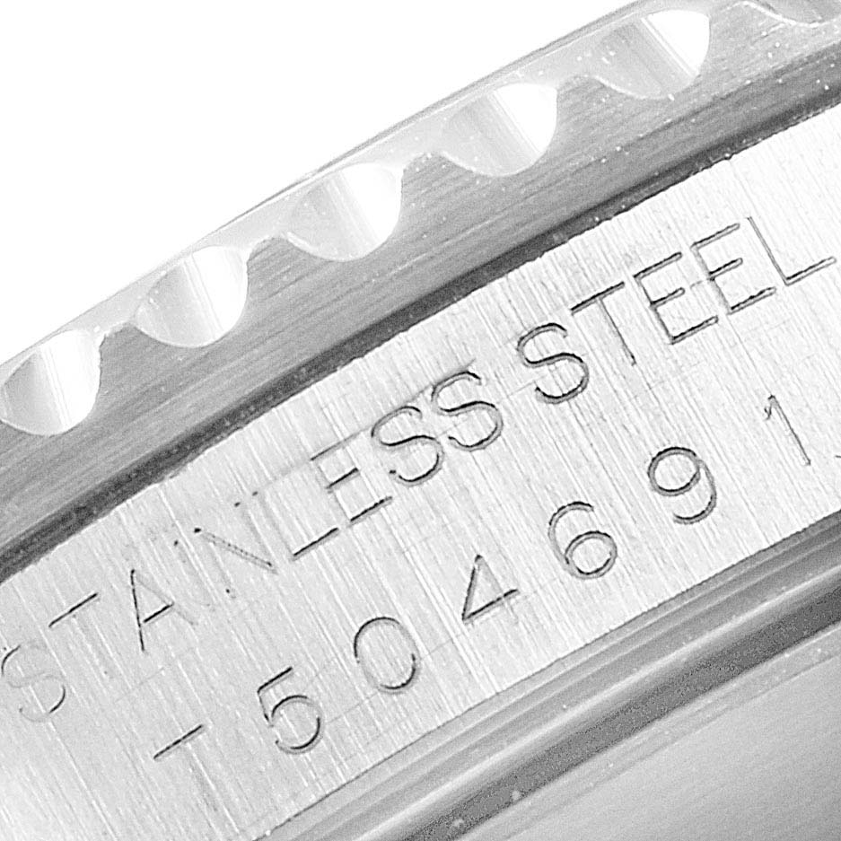 This image shows a close-up of the engraved side of the bezel and the case of a Rolex Submariner 14060 Men
s Stainless Steel Black Dial 14060 Men
s Stainless Steel Black Dial watch.