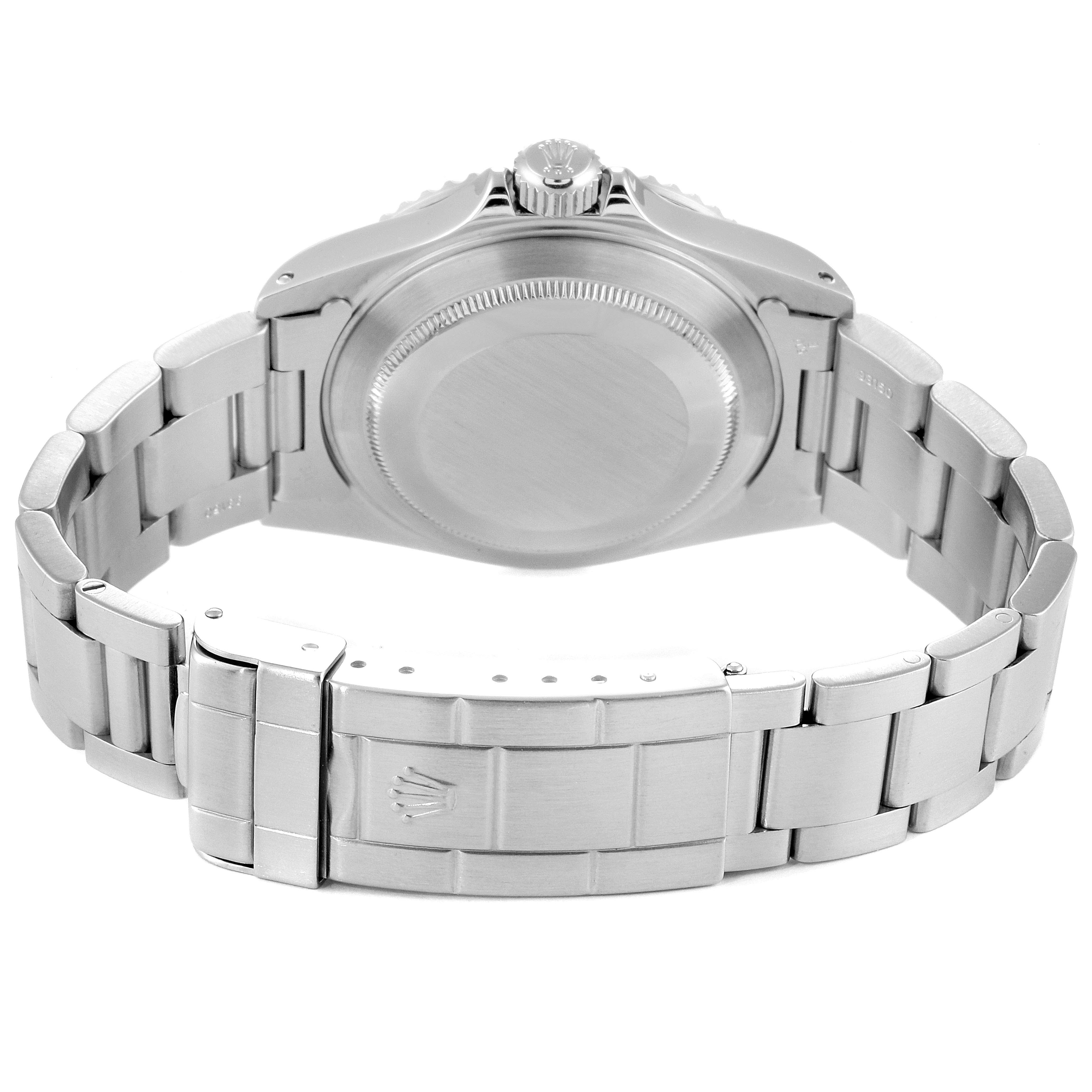 This Rolex Submariner 14060 Men
s Stainless Steel Black Dial 14060 Men
s Stainless Steel Black Dial watch is shown from the back, displaying the closed clasp and case back.