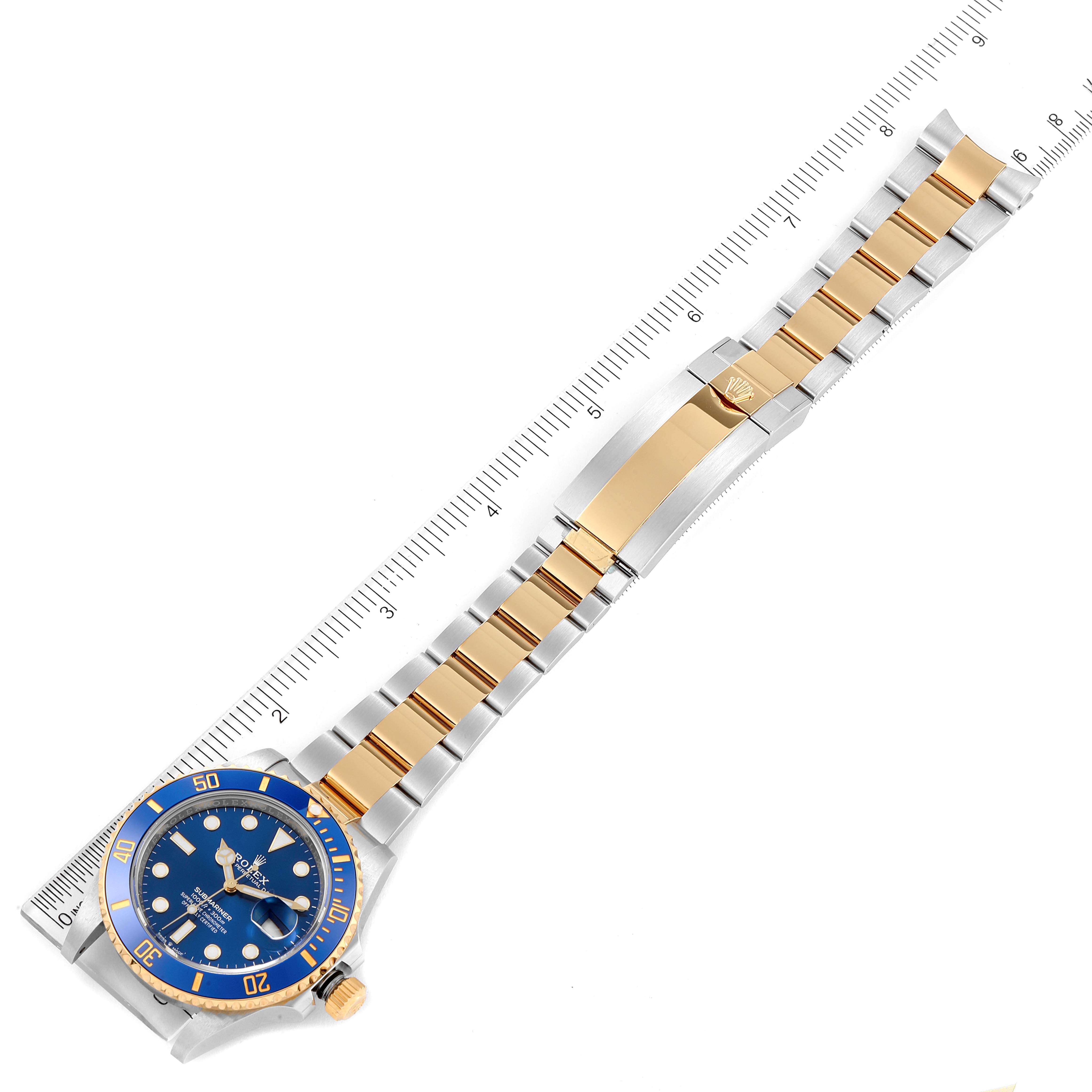 The Rolex Submariner 126613 Men
s Steel and Gold (two tone) Blue Dial 126613 Men
s Steel and Gold (two tone) Blue Dial watch is shown from a top angle, displaying its blue dial, bezel, and two-tone gold and stainless steel bracelet.