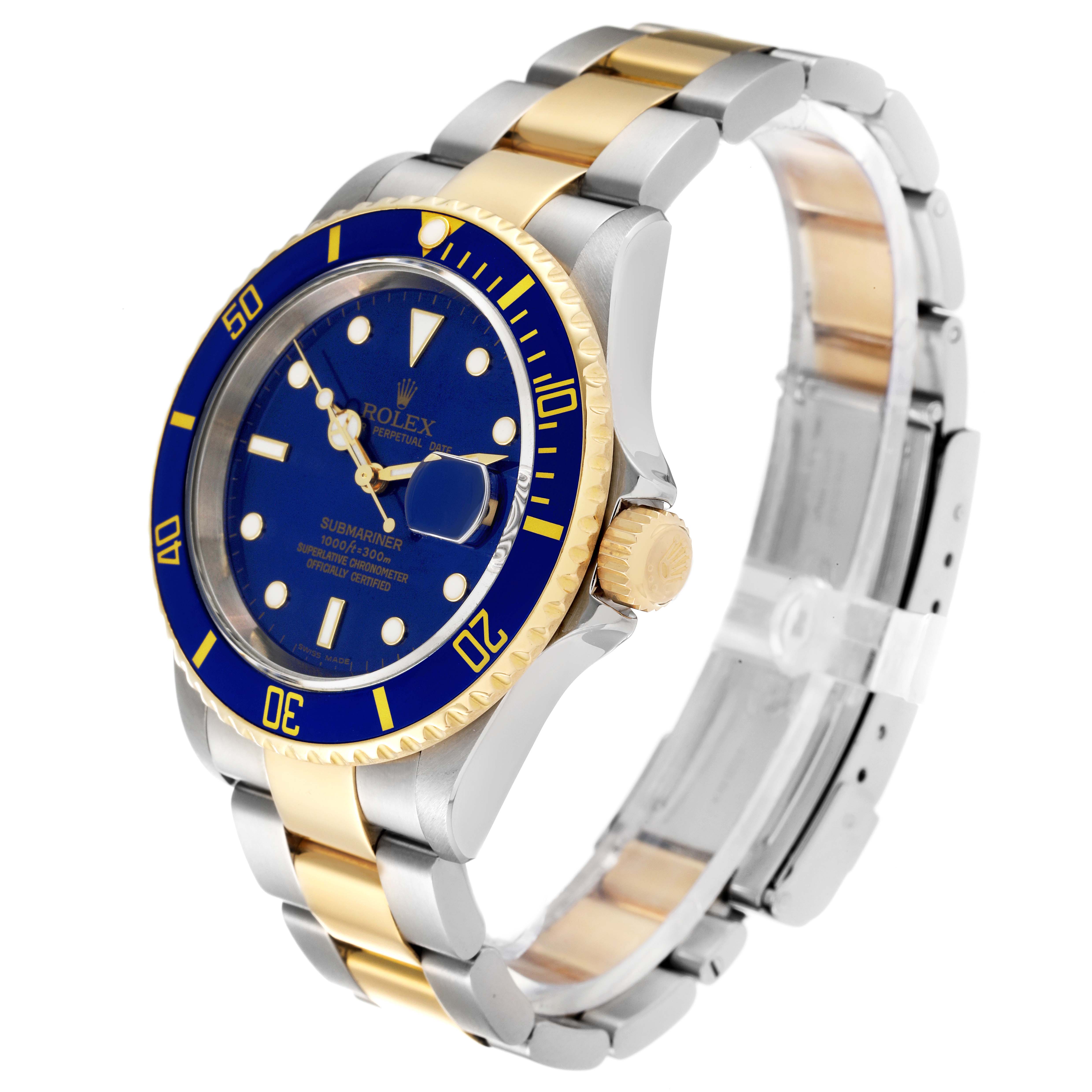 The image shows a Rolex Submariner 16613 Men's Steel and Gold (two tone) Blue Dial 16613 Men's Steel and Gold (two tone) Blue Dial watch at an angle highlighting its blue dial, gold bezel, and two-tone bracelet.