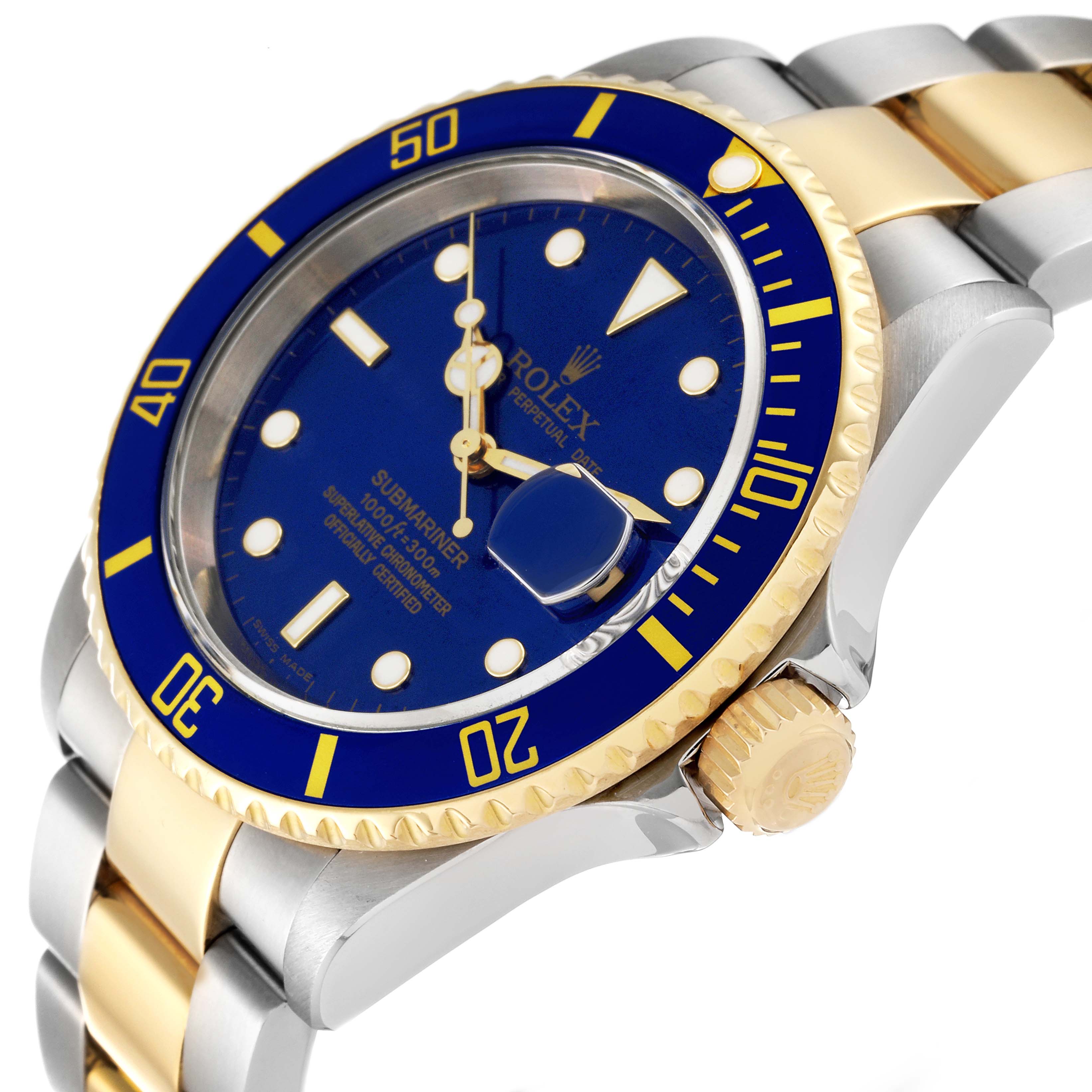 The image shows a close-up angle of a Rolex Submariner 16613 Men's Steel and Gold (two tone) Blue Dial 16613 Men's Steel and Gold (two tone) Blue Dial watch, highlighting its blue dial, bezel, crown, and two-tone bracelet.
