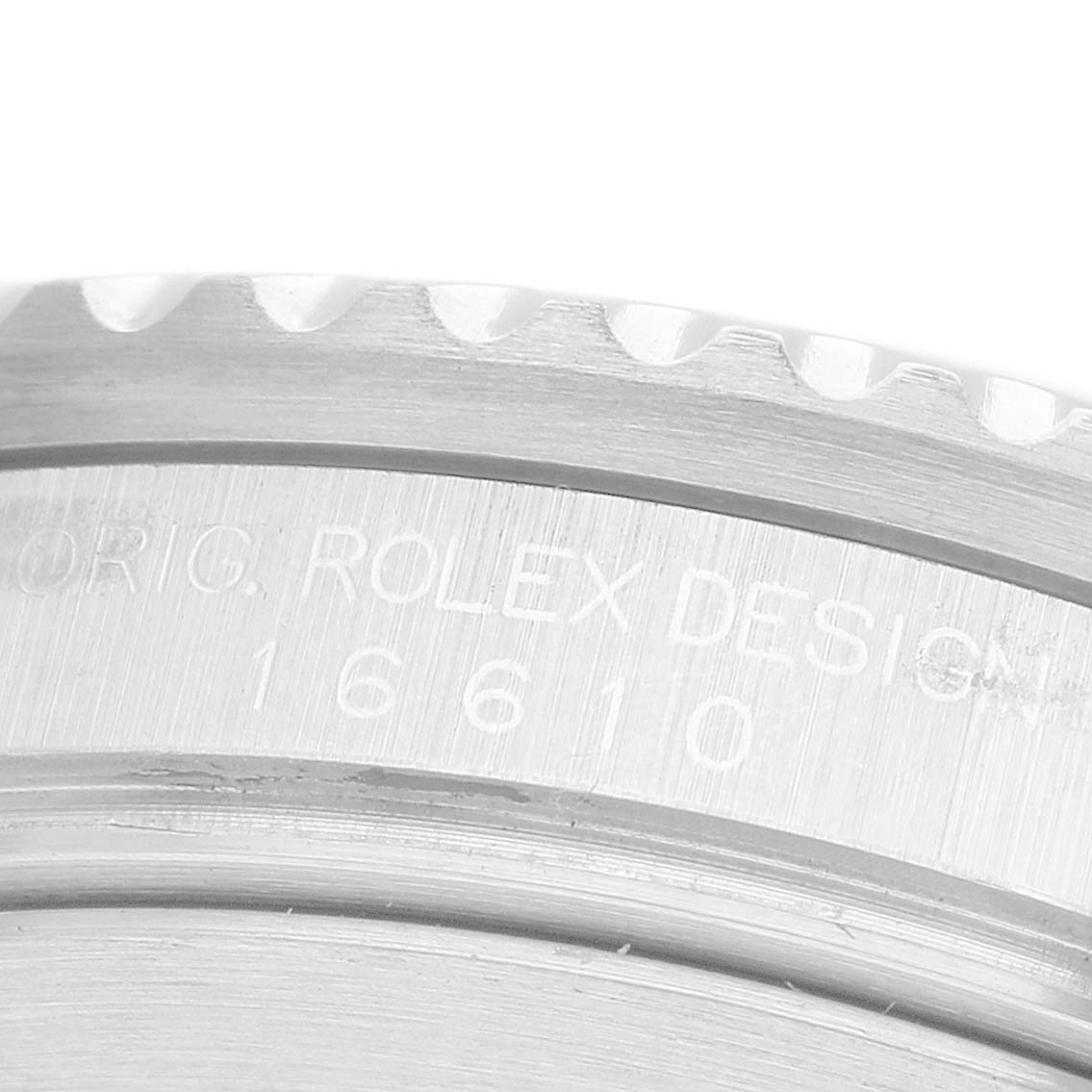 The image shows the engraved side of the bezel and case edge of a Rolex Submariner 16610 Men's Stainless Steel Black Dial, model 16610.