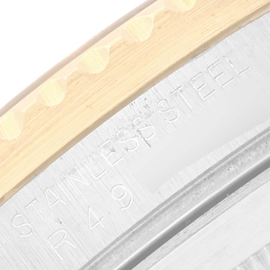 The image shows a close-up of the caseback and outer bezel of a Rolex Submariner 16803 Men's Steel and Gold (two tone) Black Dial 16803 Men's Steel and Gold (two tone) Black Dial watch, highlighting the "STAINLESS STEEL" engraving.