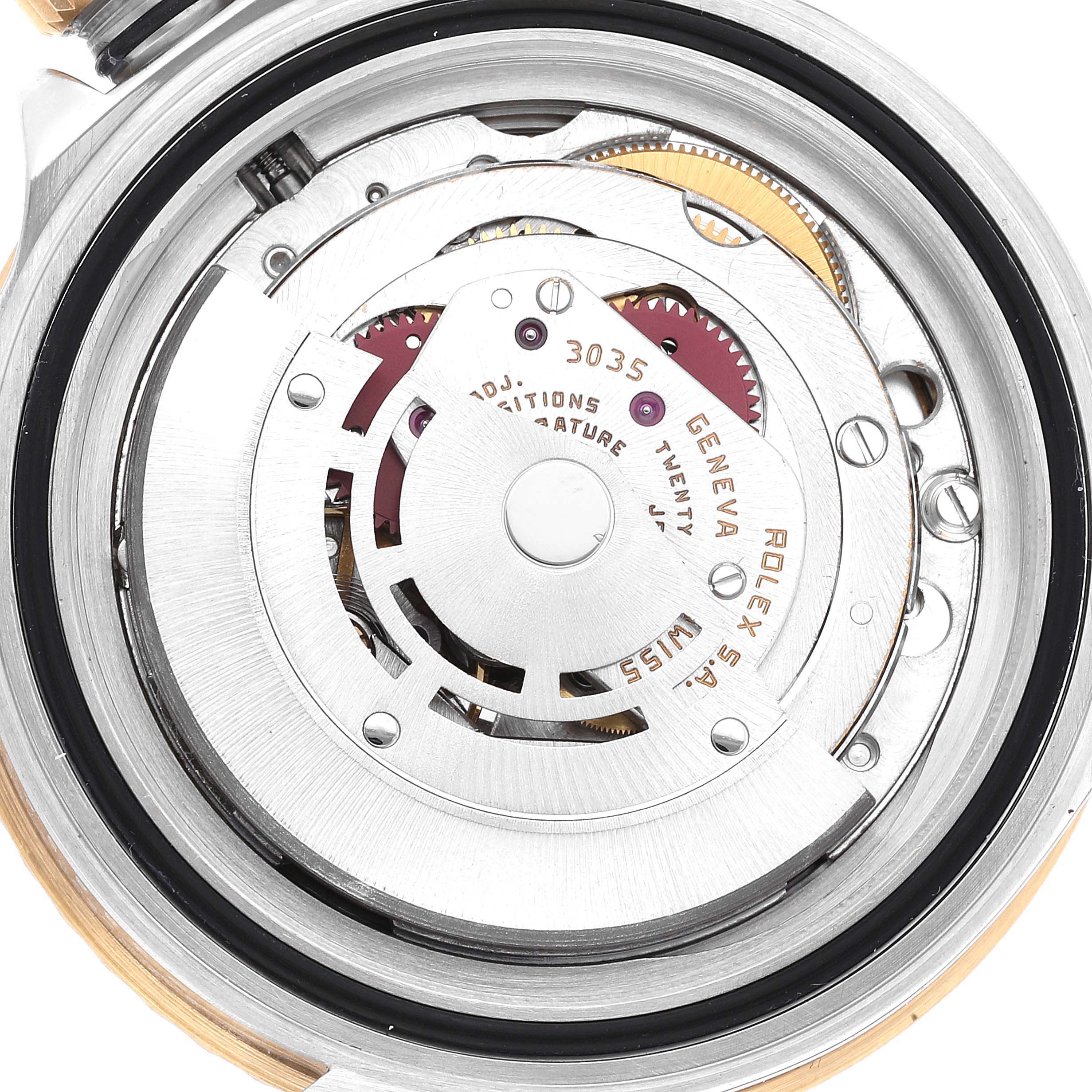 The image shows the internal mechanics of a Rolex Submariner 16803 Men's Steel and Gold (two tone) Black Dial 16803 Men's Steel and Gold (two tone) Black Dial watch, focusing on the movement components.