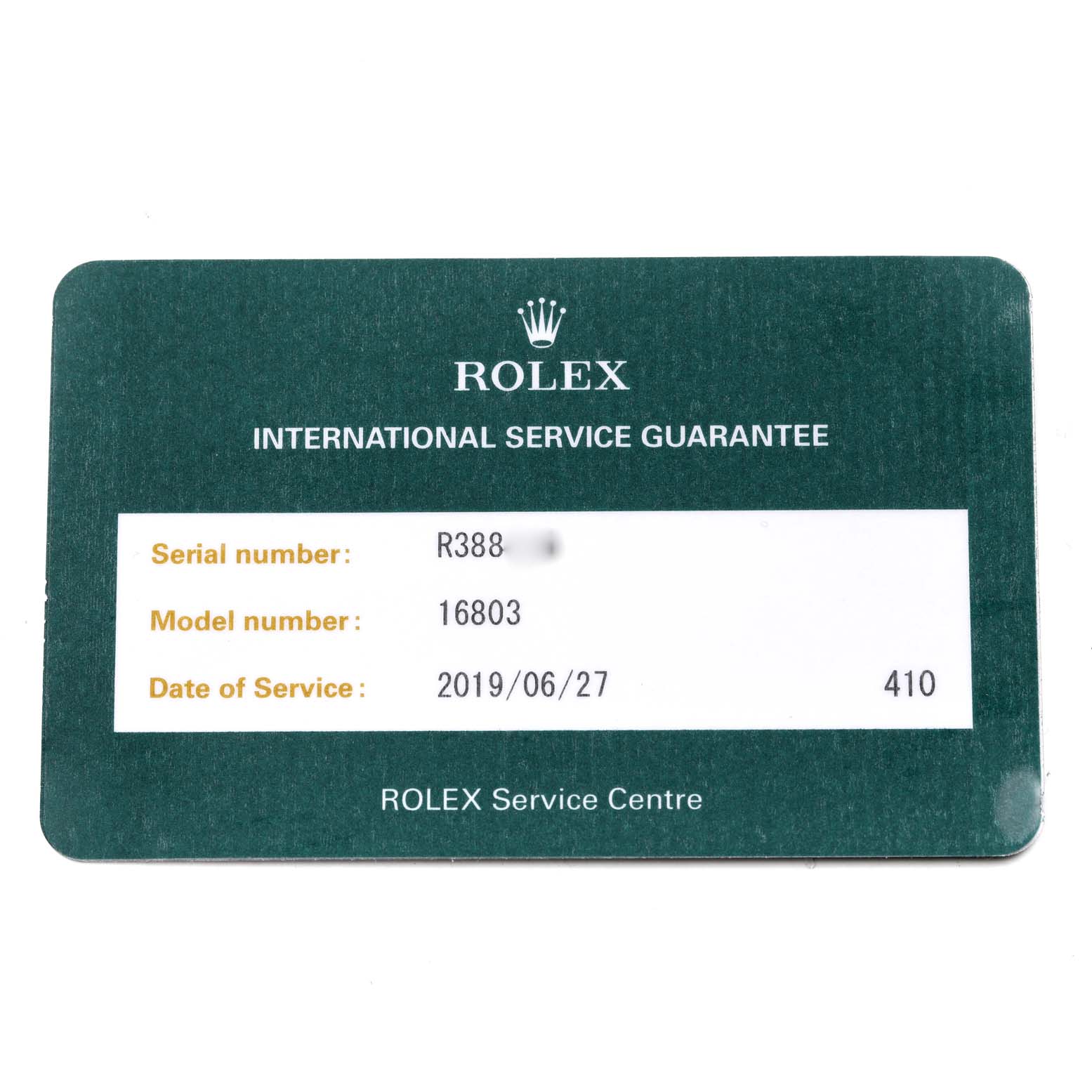 This image shows the International Service Guarantee card for a Rolex Submariner 16803 Men's Steel and Gold (two tone) Black Dial 16803 Men's Steel and Gold (two tone) Black Dial model 16803.
