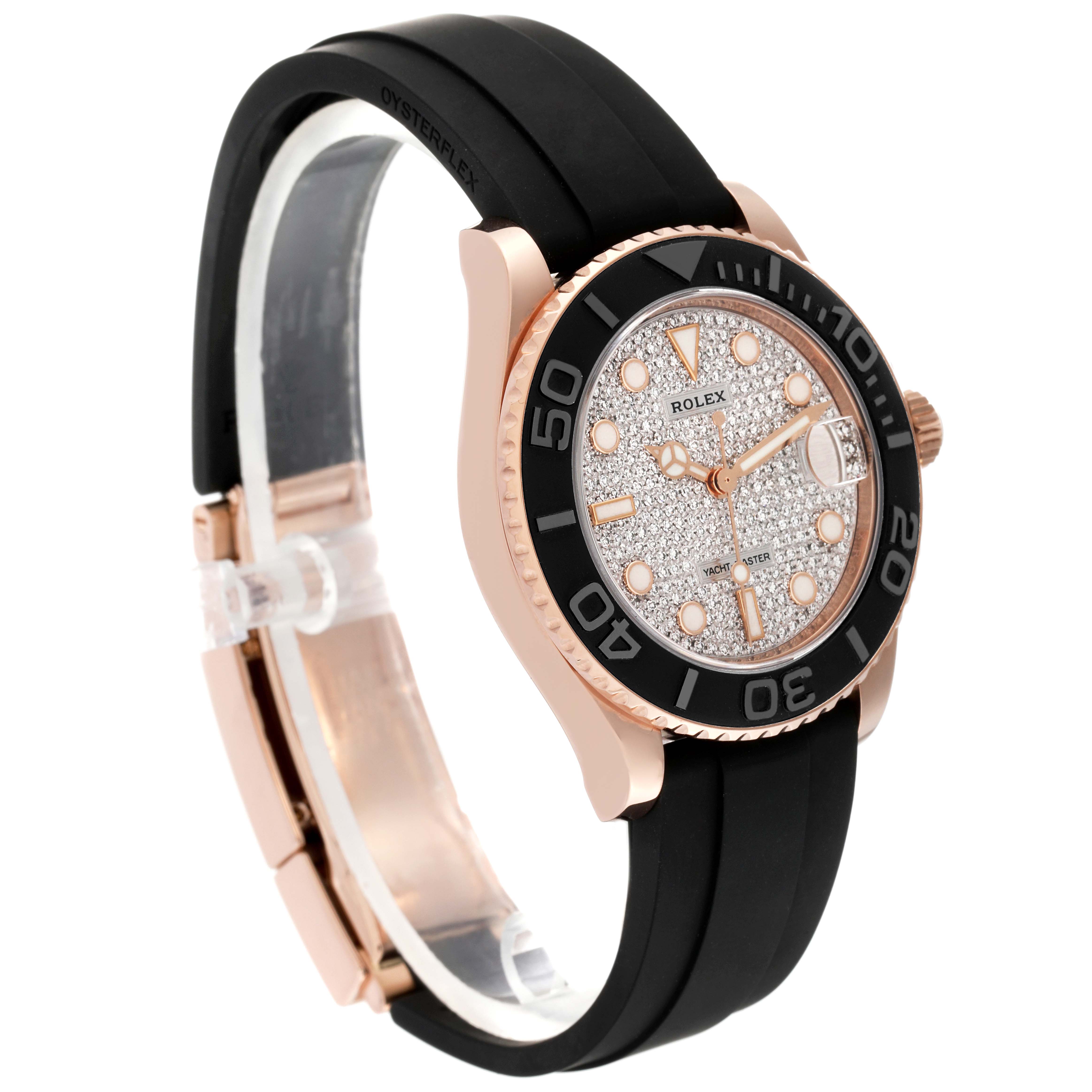 The image shows a side angle of a Rolex Yacht-Master 268655 Men's Rose Gold Silver Dial 268655 Men's Rose Gold Silver Dial watch with a black rubber strap and a diamond-studded dial.