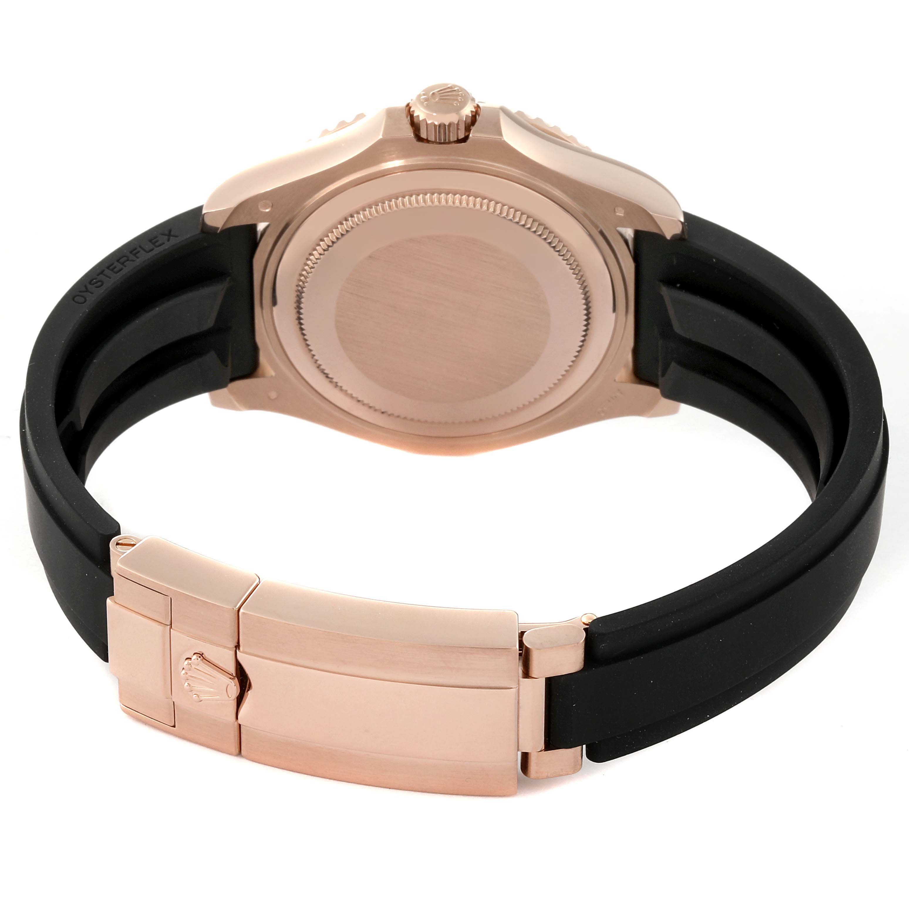 This image shows the back case and bracelet clasp of a Rolex Yacht-Master 268655 Men's Rose Gold Silver Dial 268655 Men's Rose Gold Silver Dial watch with a rose gold finish and black strap.