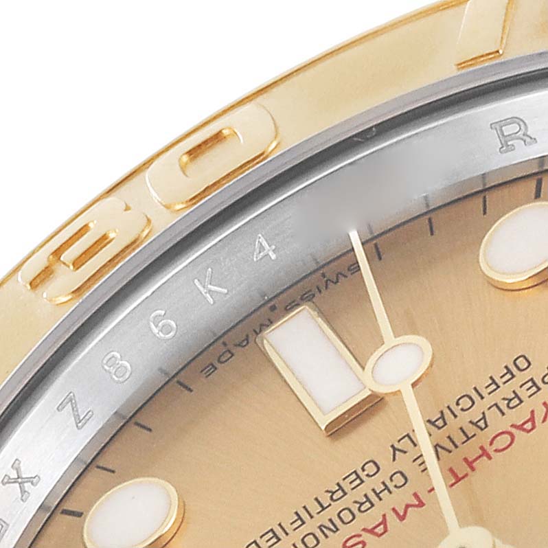 The image shows a close-up of the bezel, dial, and part of the markers of a Rolex Yacht-Master 16623 Men's Steel and Gold (two tone) Champagne Dial 16623 Men's Steel and Gold (two tone) Champagne Dial watch.