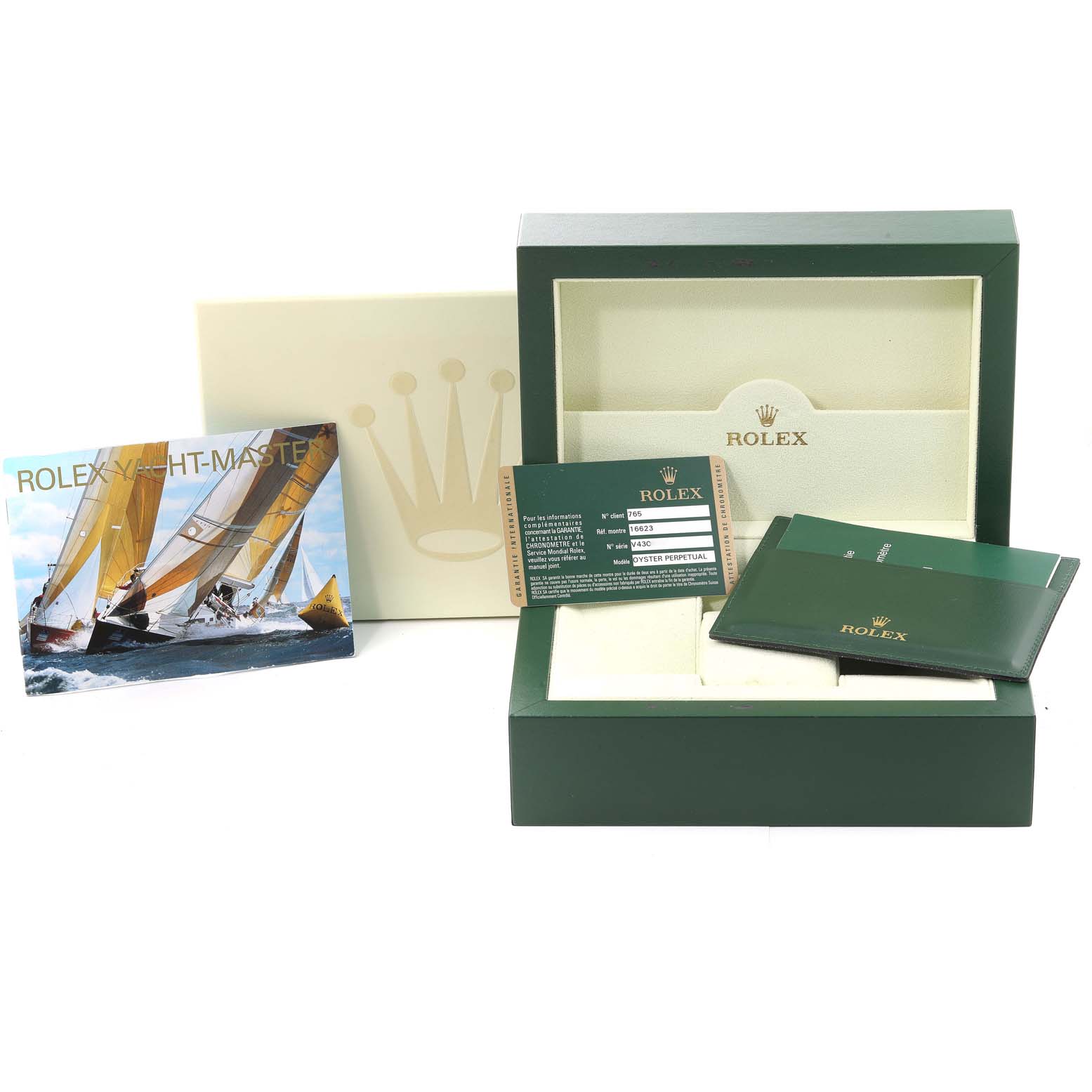 This image shows the packaging and accessories of a Rolex Yacht-Master 16623 Men's Steel and Gold (two tone) Grey Dial 16623 Men's Steel and Gold (two tone) Grey Dial watch, including the box, documentation, and cardholder.