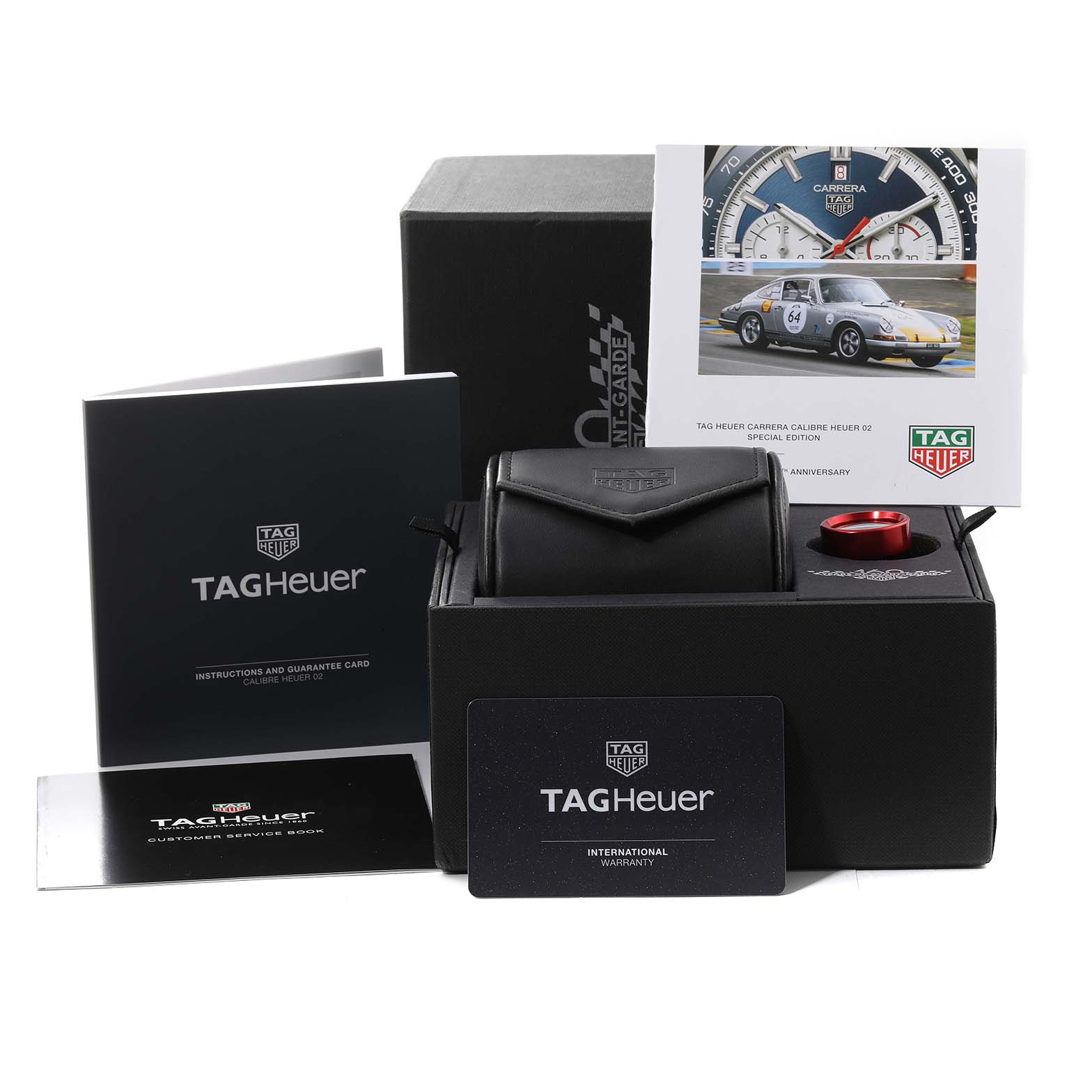 The image shows Tag Heuer Carrera CBN2A1E.BA0643 Men's Stainless Steel Blue Dial CBN2A1E.BA0643 Men's Stainless Steel Blue Dial watch packaging, including manuals, a warranty card, and a watch pouch.
