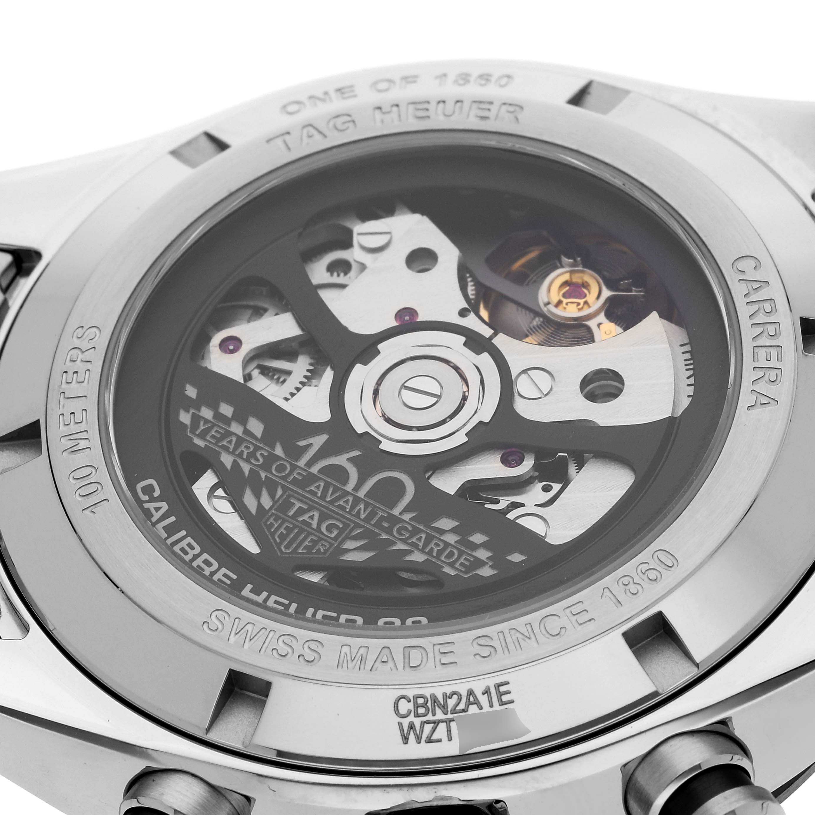 The image shows the back of a Tag Heuer Carrera CBN2A1E.BA0643 Men's Stainless Steel Blue Dial CBN2A1E.BA0643 Men's Stainless Steel Blue Dial watch, highlighting its internal mechanisms and engravings.