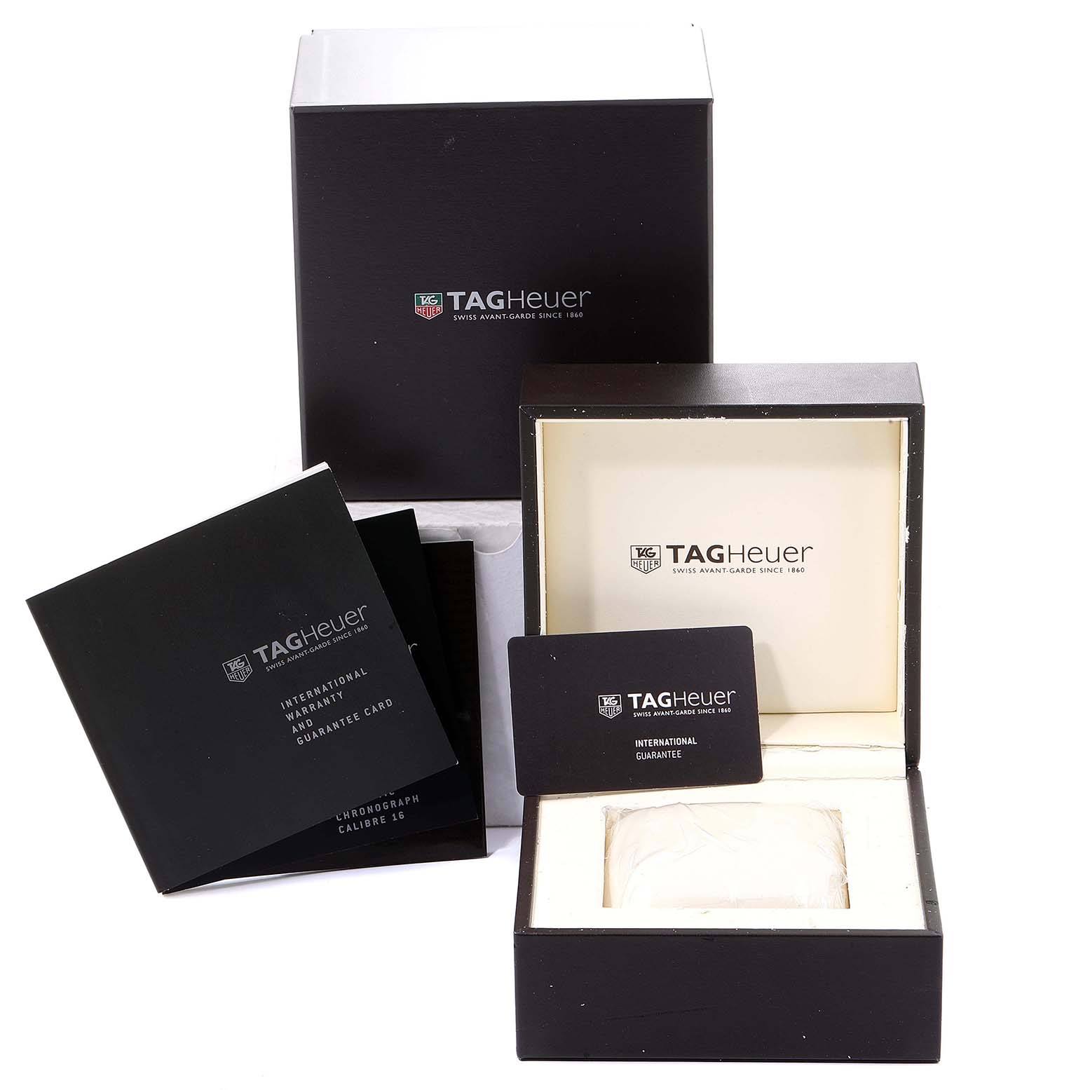 The image shows the packaging, inner box, and documentation for the Limited Edition Tag Heuer watch.
