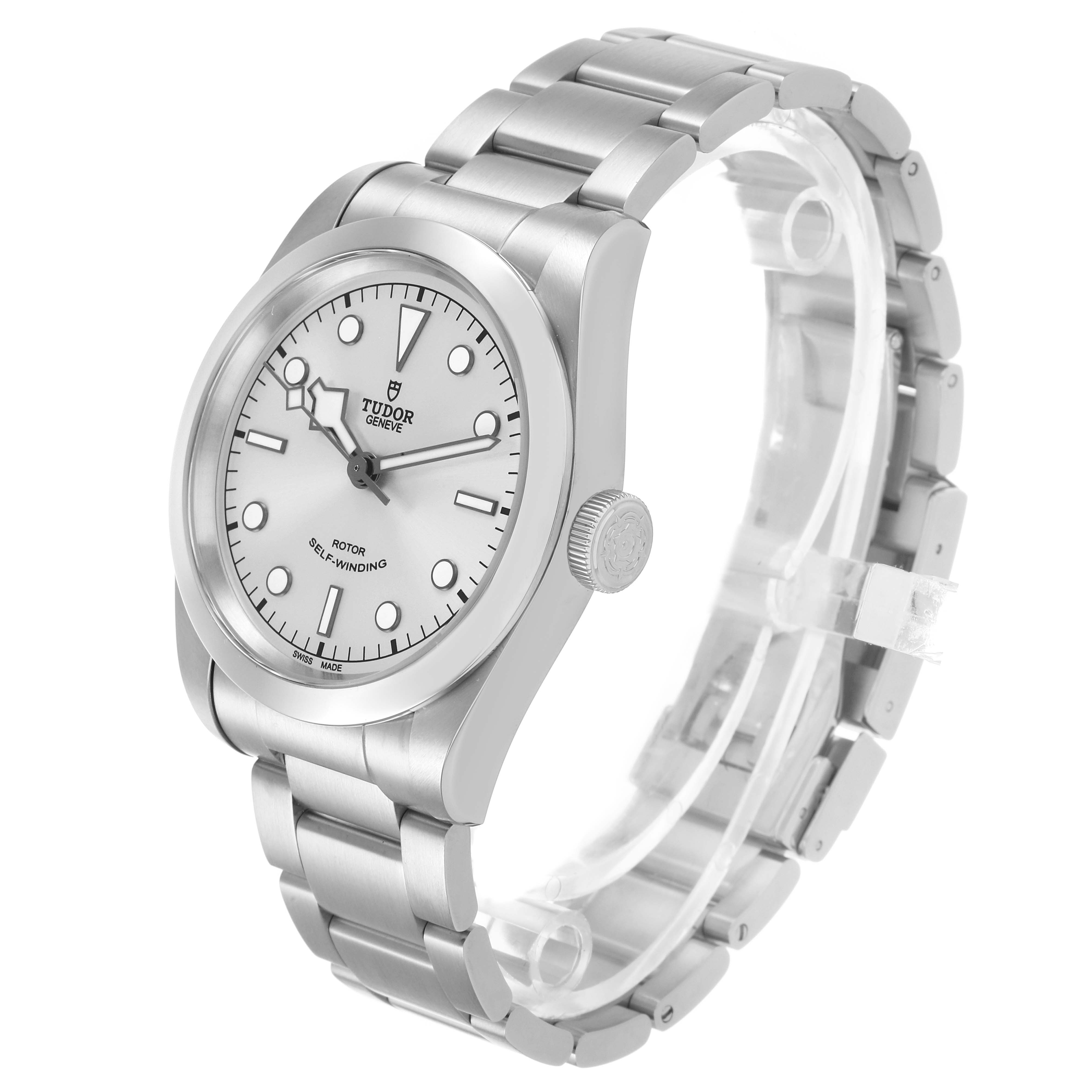 The Tudor Heritage Black Bay M79540 Men's Stainless Steel Silver Dial watch is shown at a three-quarter angle, displaying its face, bezel, case, crown, and bracelet.