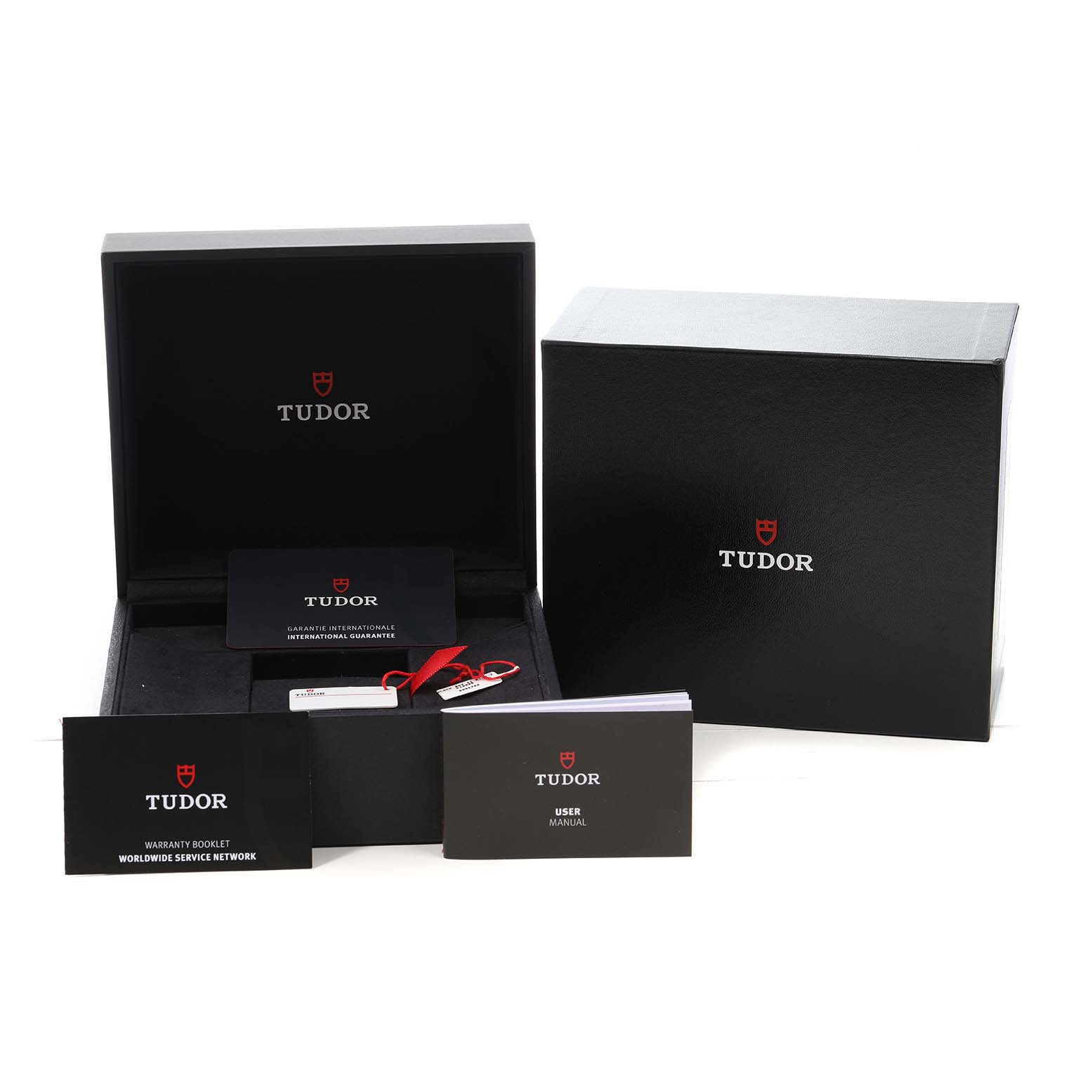The image shows the Tudor Heritage Black Bay M79540 Men's Stainless Steel Silver Dial's packaging, including the box, warranty card, and manuals.