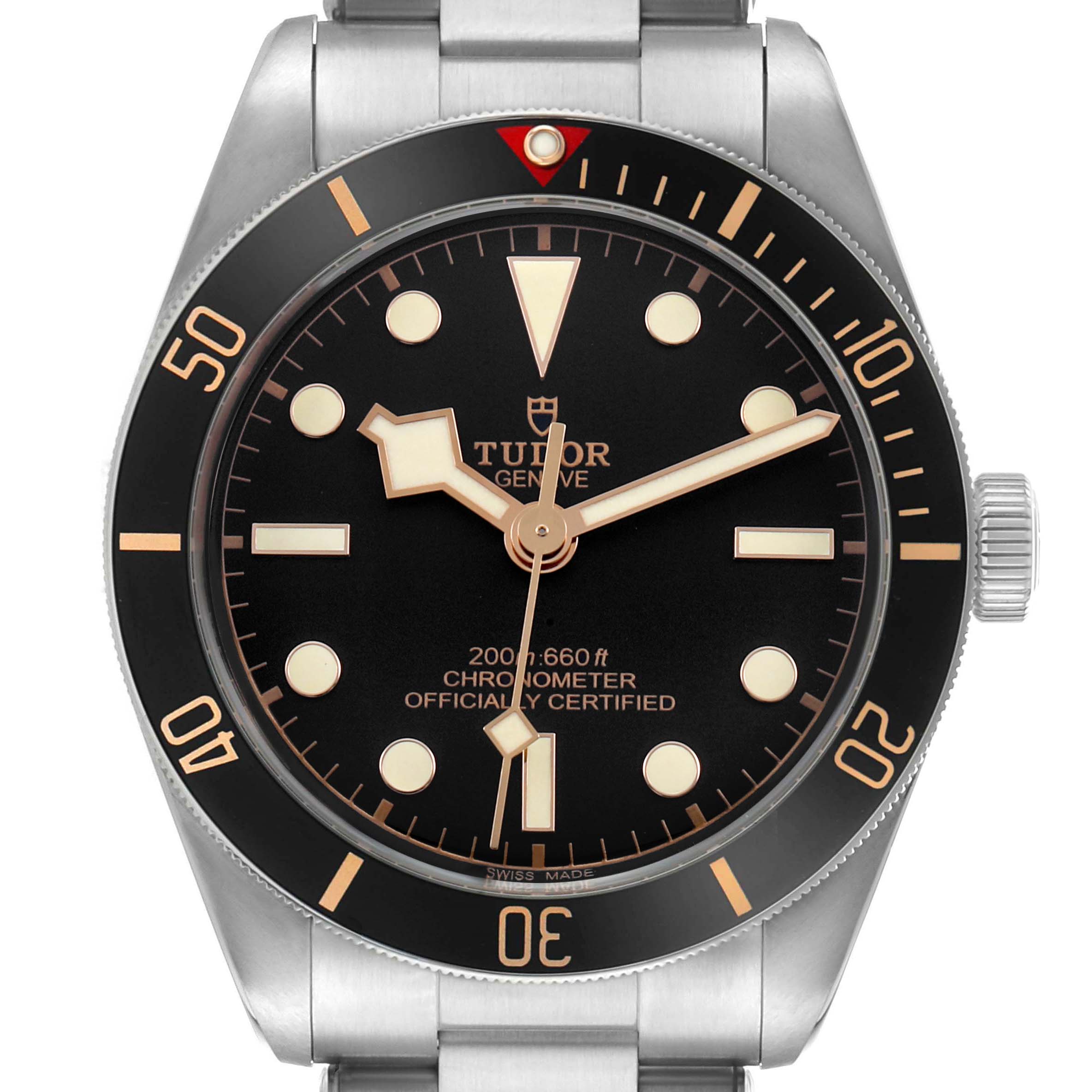 The Tudor Heritage Black Bay 79030 Men's Stainless Steel Black Dial watch is shown from a front angle, displaying the dial, bezel, and part of the bracelet.