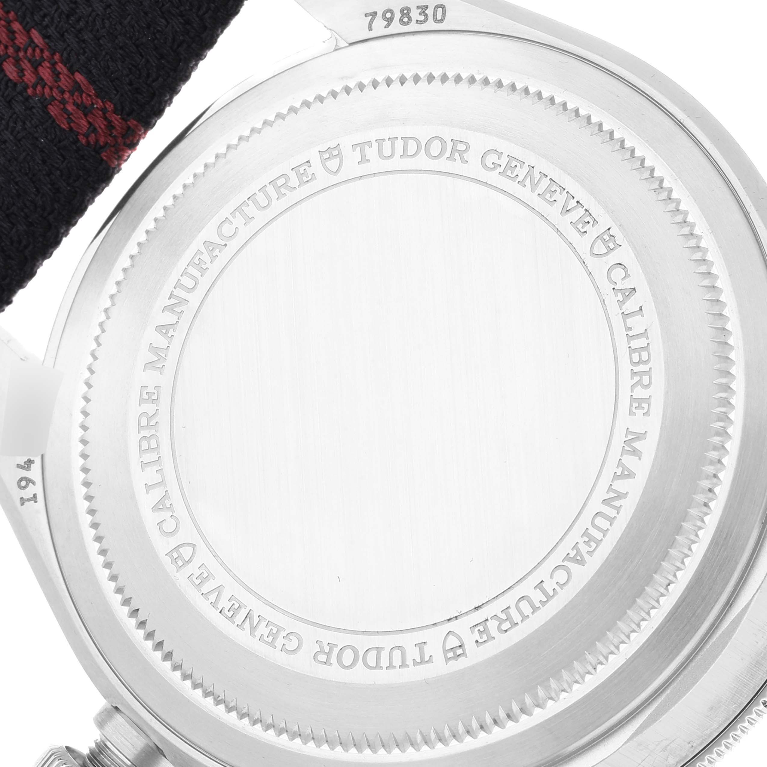 The image shows the case back of the Tudor Heritage Black Bay 79830RB Men
s Stainless Steel Black Dial 79830RB Men
s Stainless Steel Black Dial watch, displaying engravings and part of the strap.