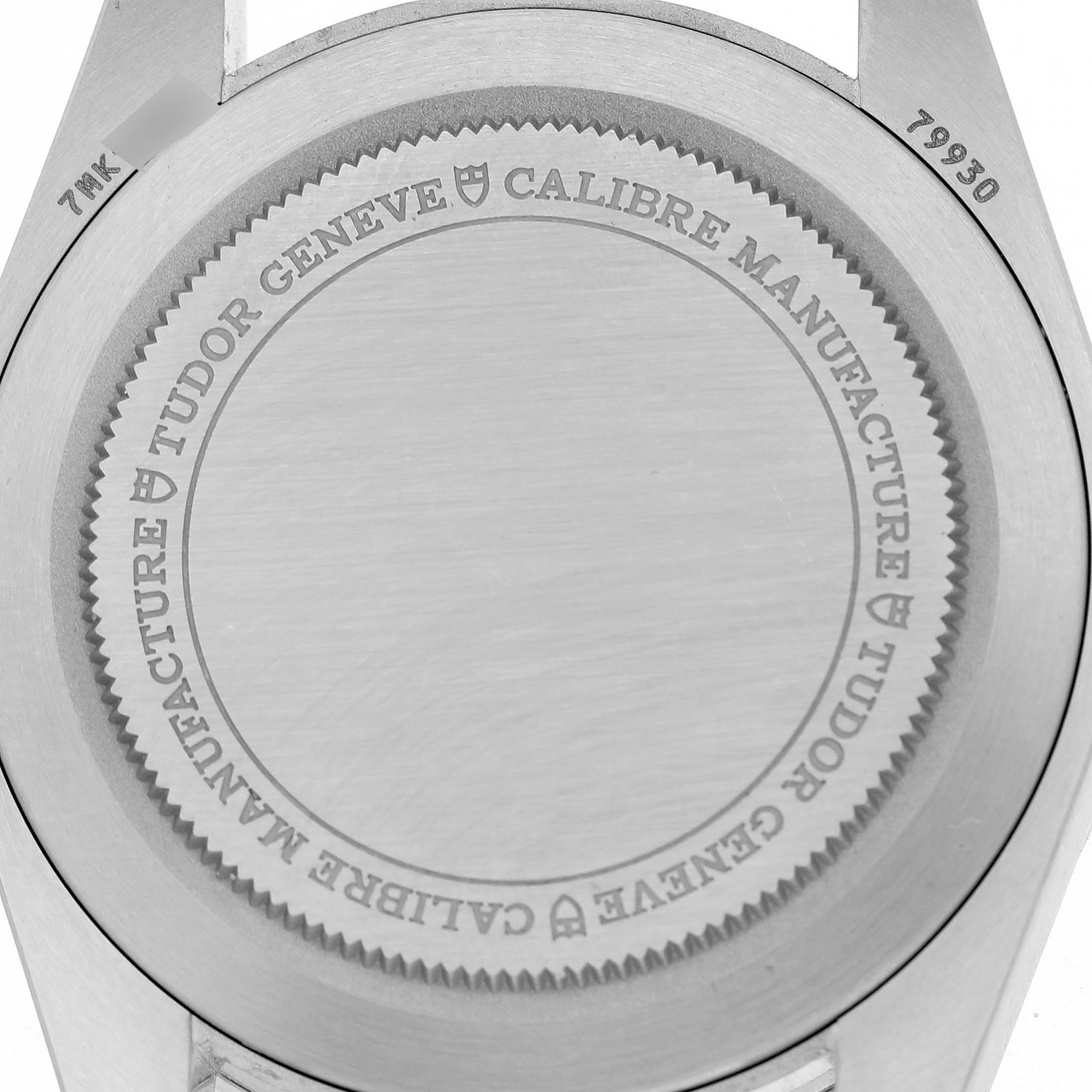 The image shows the case back of a Tudor Heritage Ranger 79930 Men's Stainless Steel Beige Dial watch, displaying its engraved details.