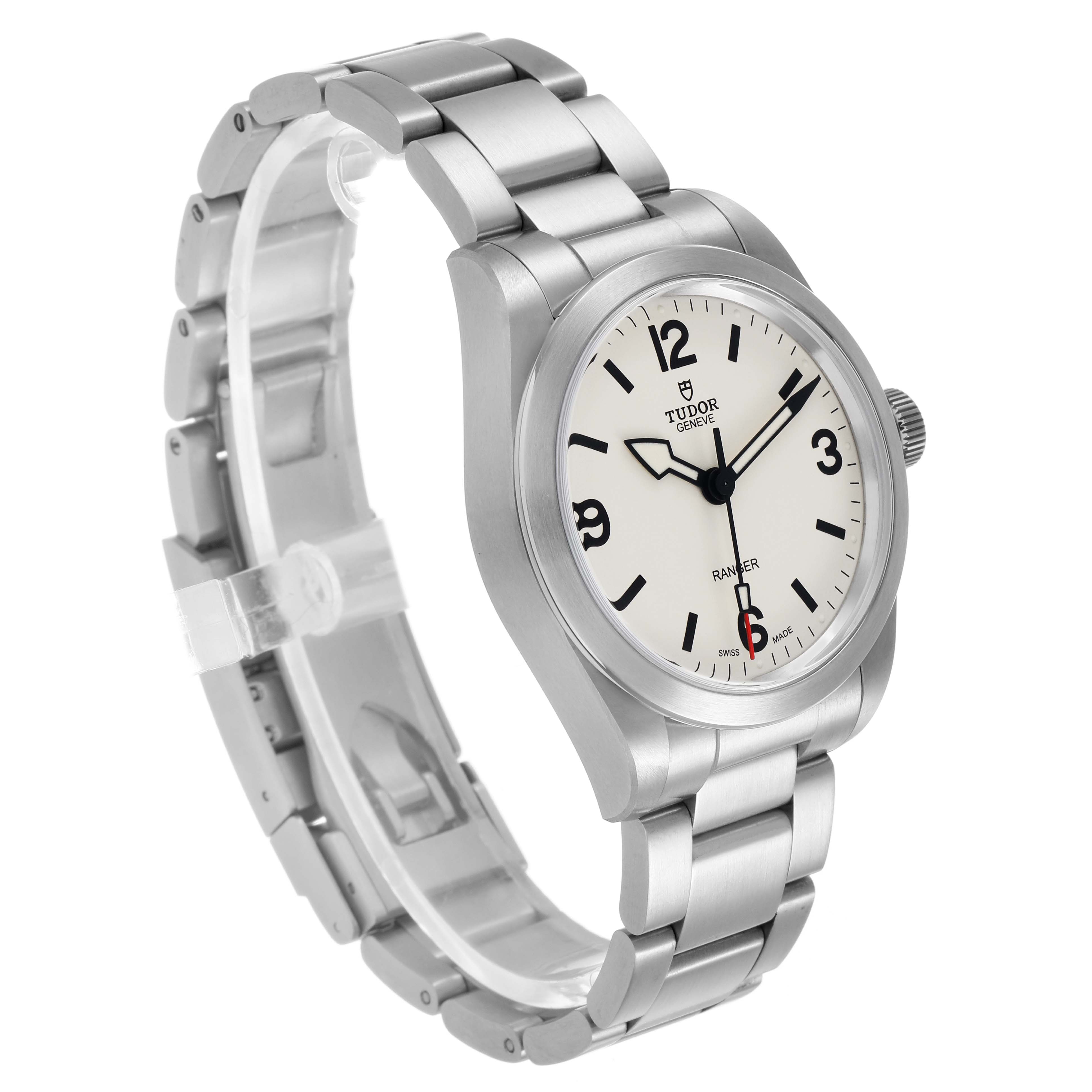 The Tudor Heritage Ranger 79930 Men's Stainless Steel Beige Dial watch is shown at a three-quarter angle, displaying the face, bezel, and bracelet.