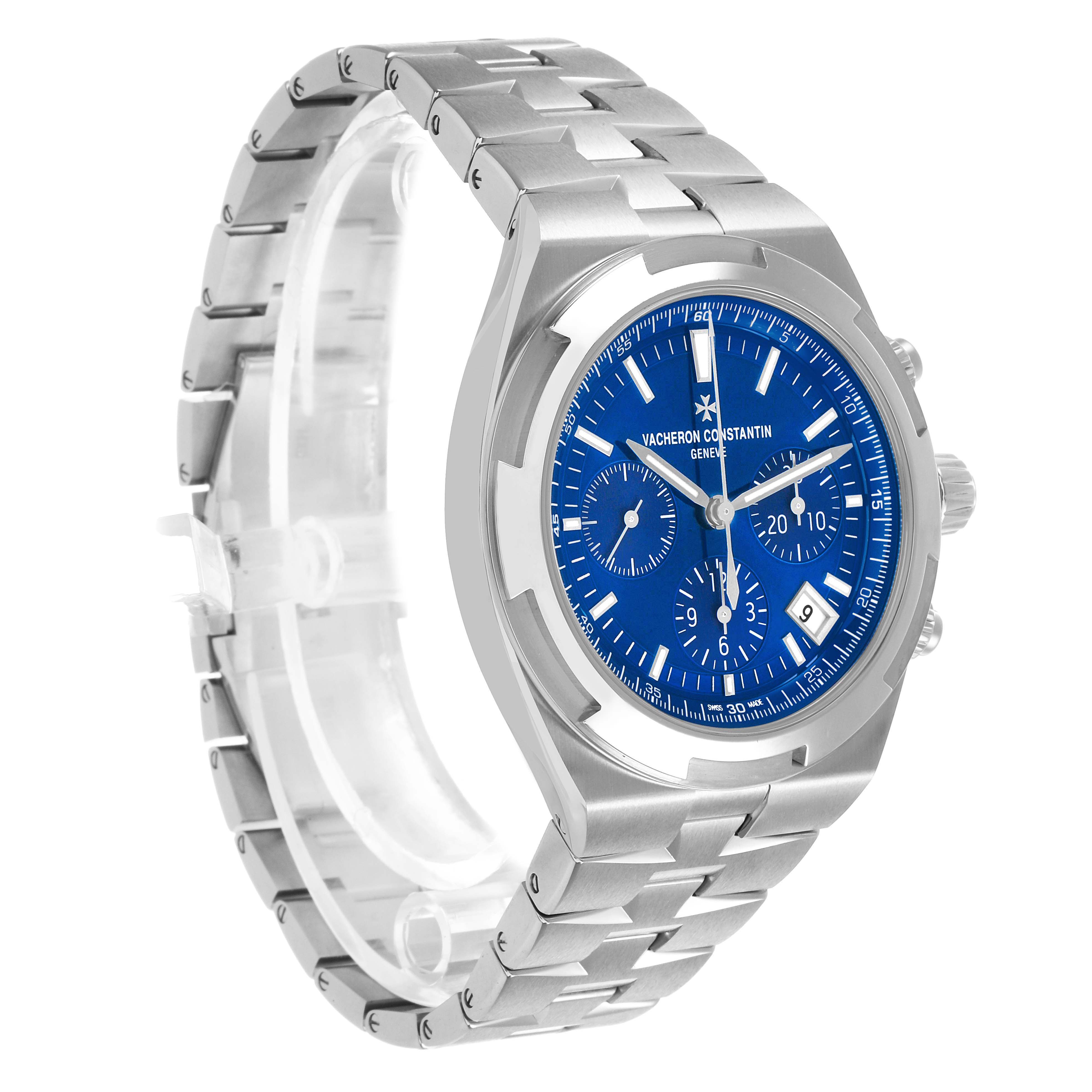 The image shows a side and partial front view of the Vacheron Constantin Overseas 5520V Men's Stainless Steel Blue Dial, highlighting its bracelet and blue dial.