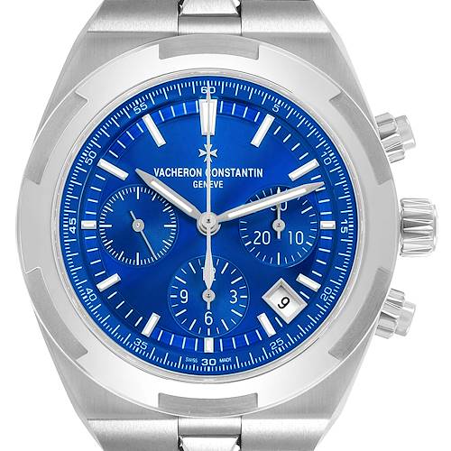 The Vacheron Constantin Overseas 5520V Men's Stainless Steel Blue Dial watch is shown from a front angle, displaying the blue dial, sub-dials, and pushers.