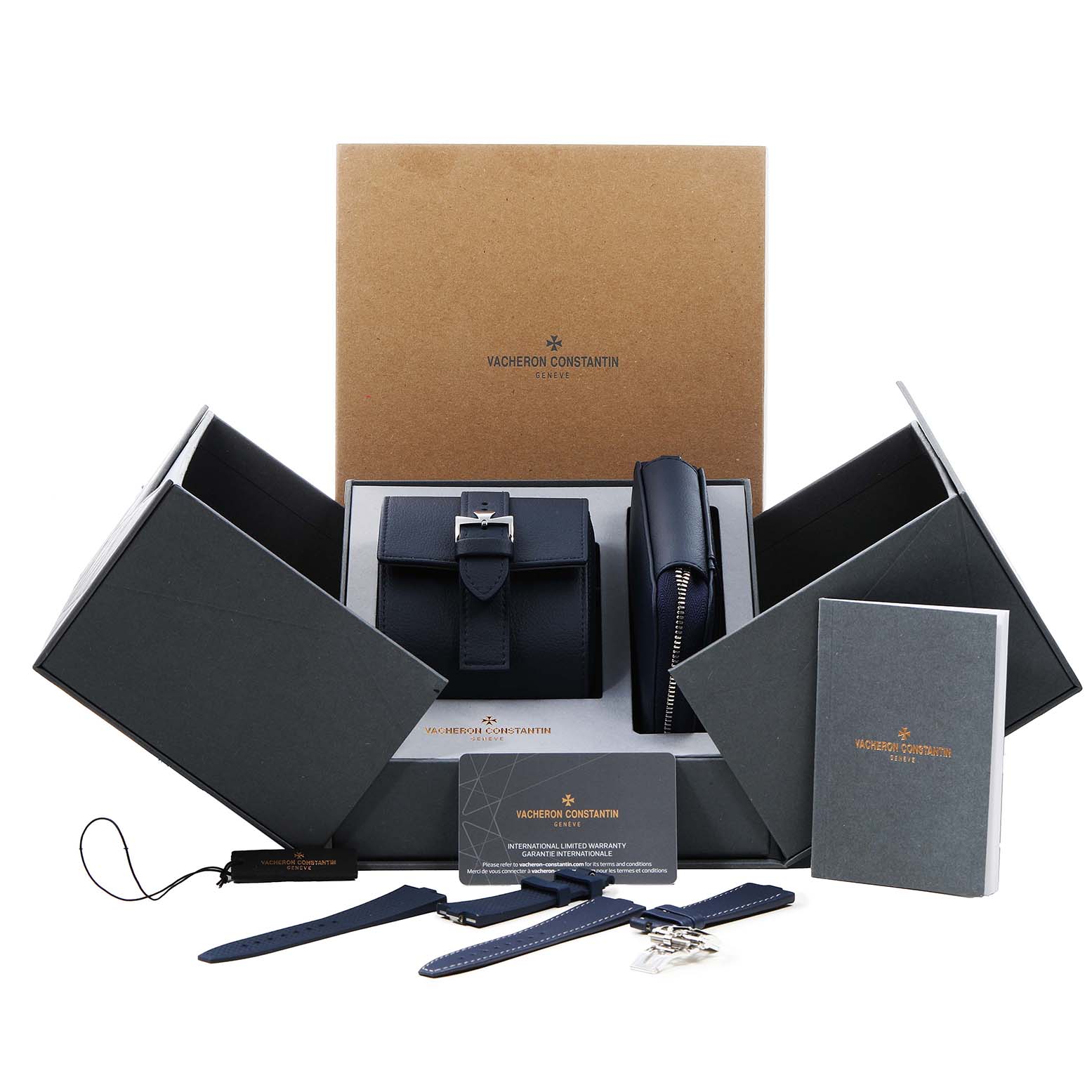 The image shows the Vacheron Constantin Overseas 5520V Men's Stainless Steel Blue Dial model packaging at an angle, displaying accessories, straps, and documentation.
