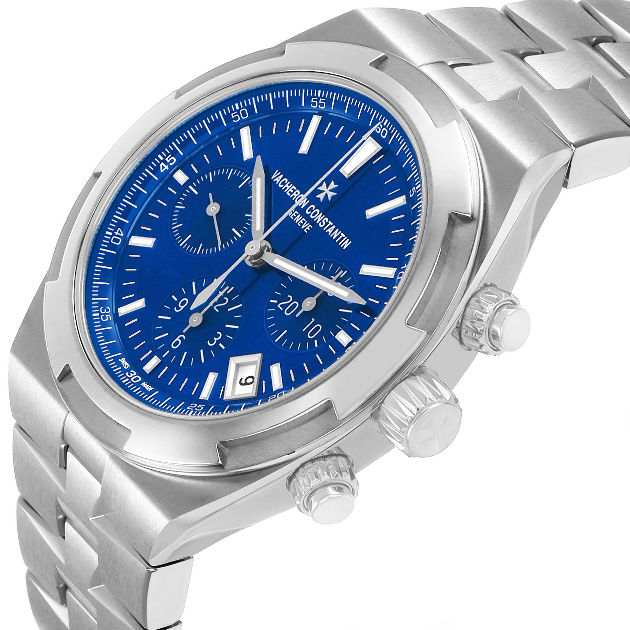 The Vacheron Constantin Overseas 5520V Men's Stainless Steel Blue Dial watch is shown at a tilted angle, highlighting the bezel, dial, chronograph sub-dials, and crown.