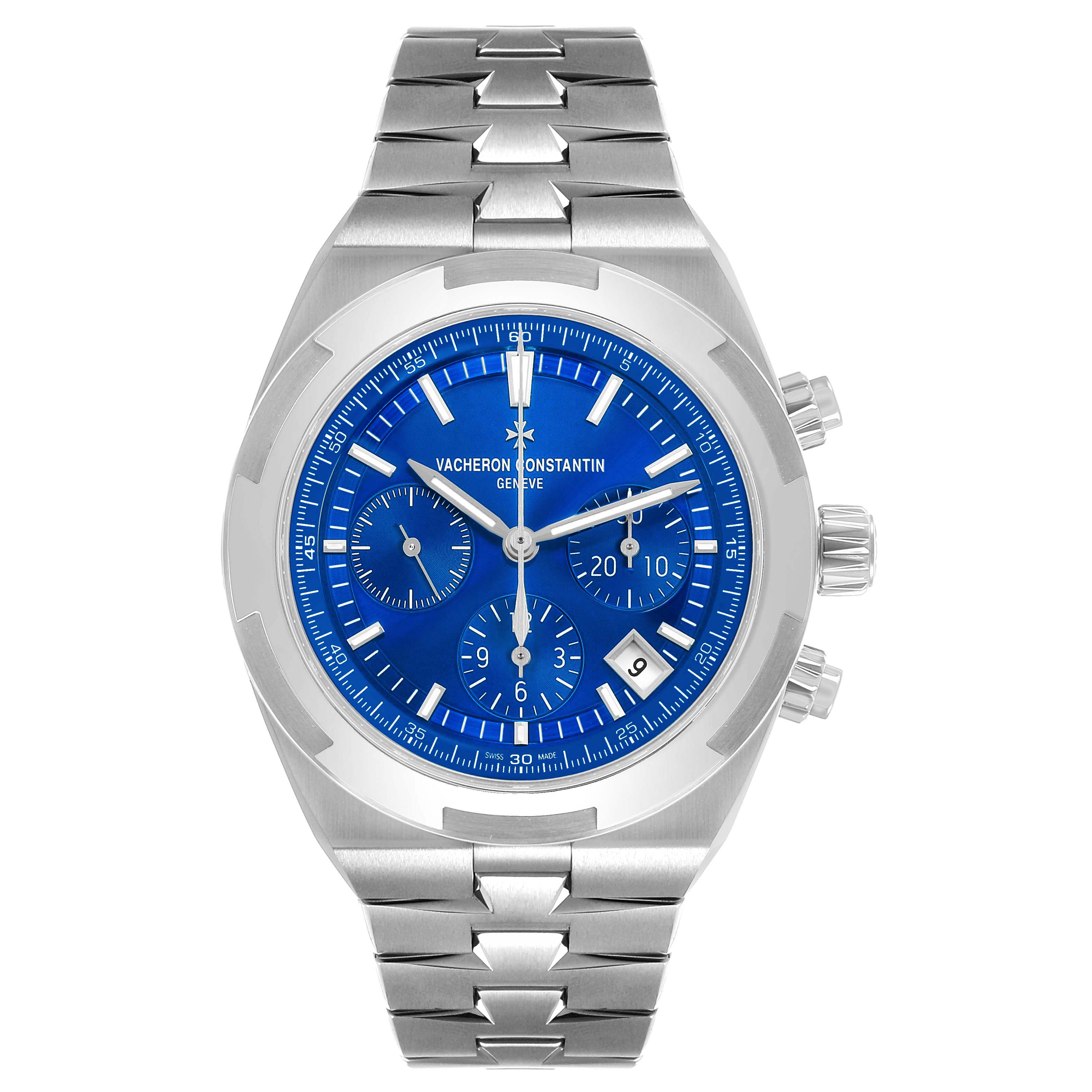 The Vacheron Constantin Overseas 5520V Men's Stainless Steel Blue Dial watch is shown from a front angle, displaying its blue dial, subdials, and stainless steel bracelet.