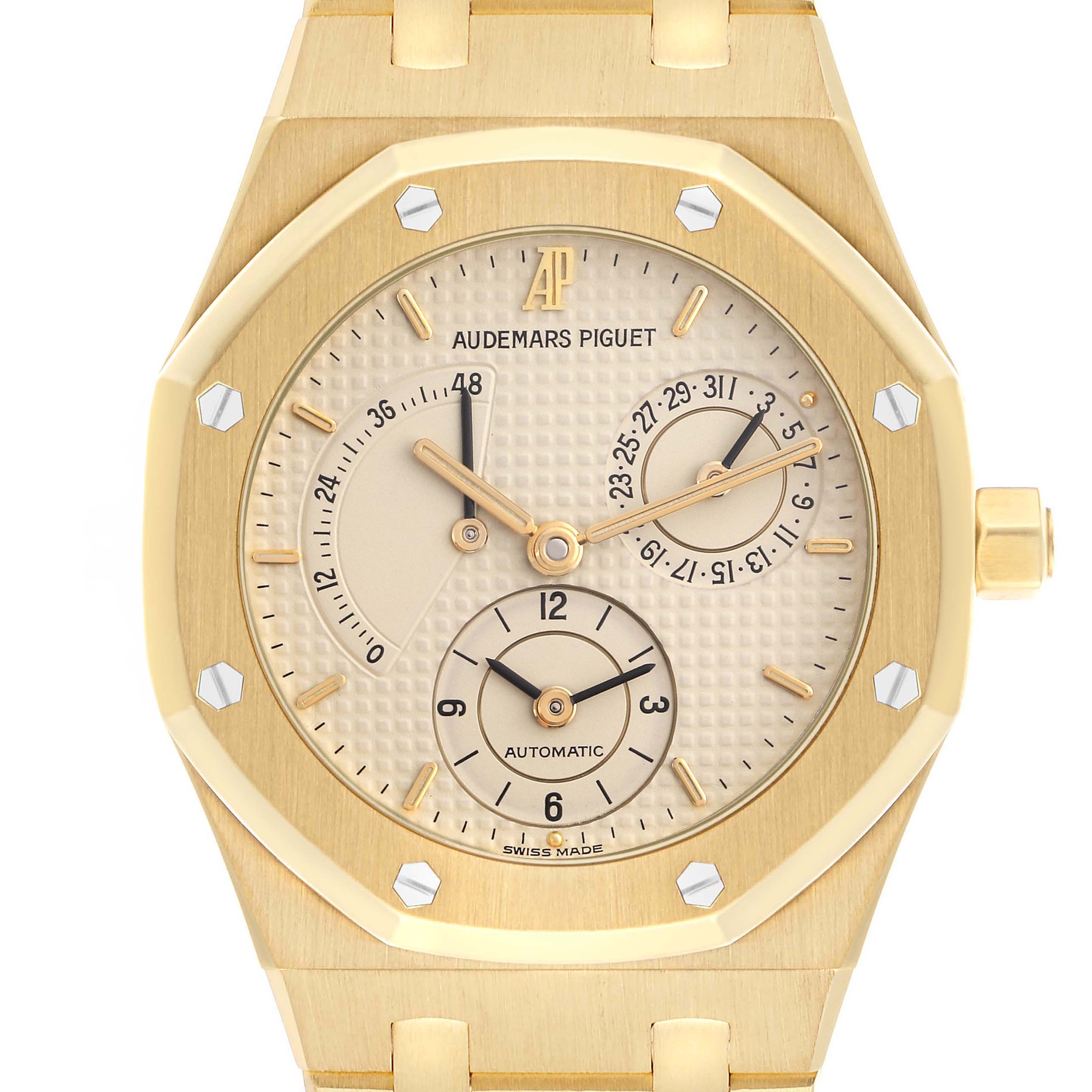 The image shows a front view of an Audemars Piguet Royal Oak 25730BA Men
s Yellow Gold Beige Dial 25730BA Men
s Yellow Gold Beige Dial watch, highlighting its gold case, dial, and subdials.