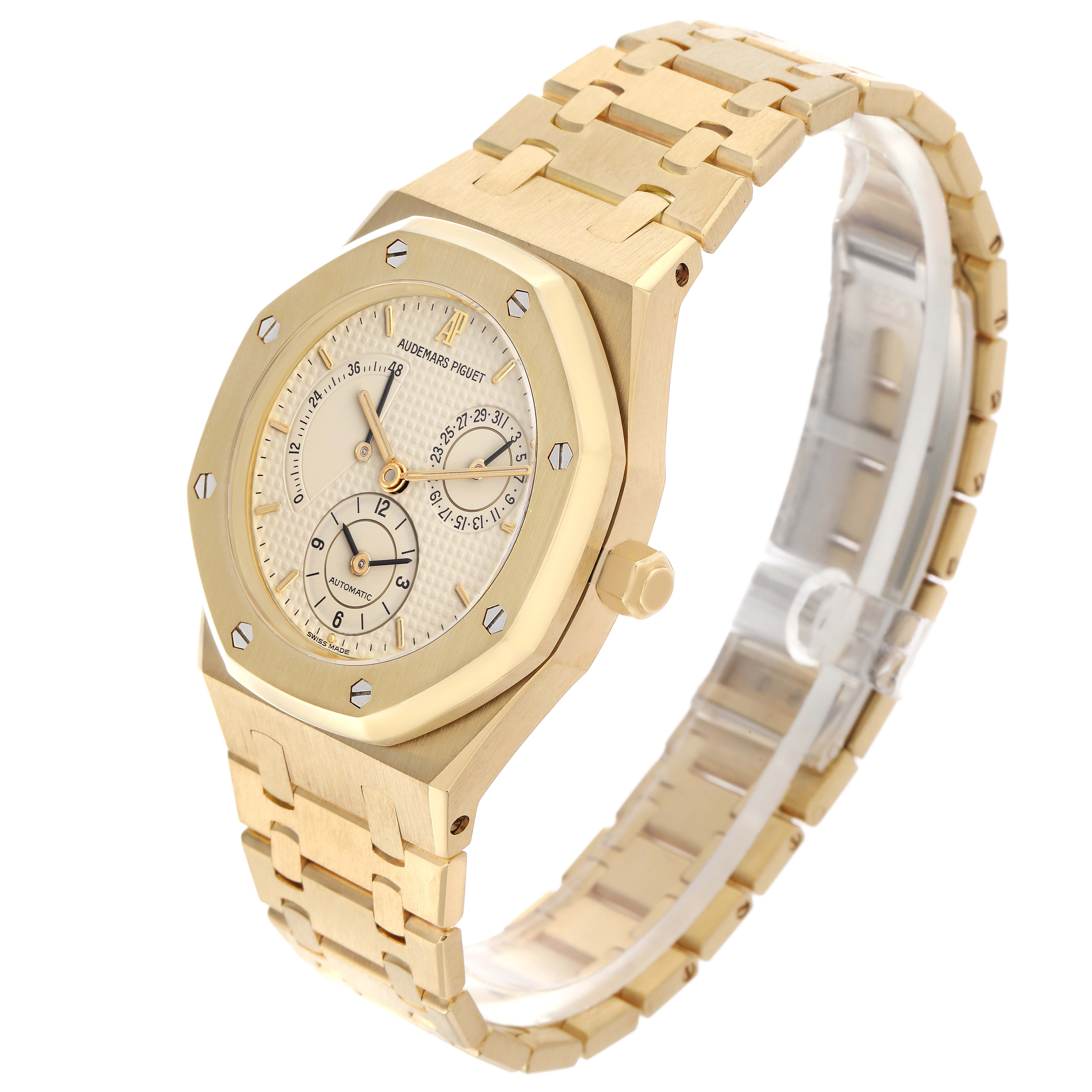 The Audemars Piguet Royal Oak 25730BA Men
s Yellow Gold Beige Dial 25730BA Men
s Yellow Gold Beige Dial watch is shown from a front-side angle, displaying the dial, bezel, and bracelet.