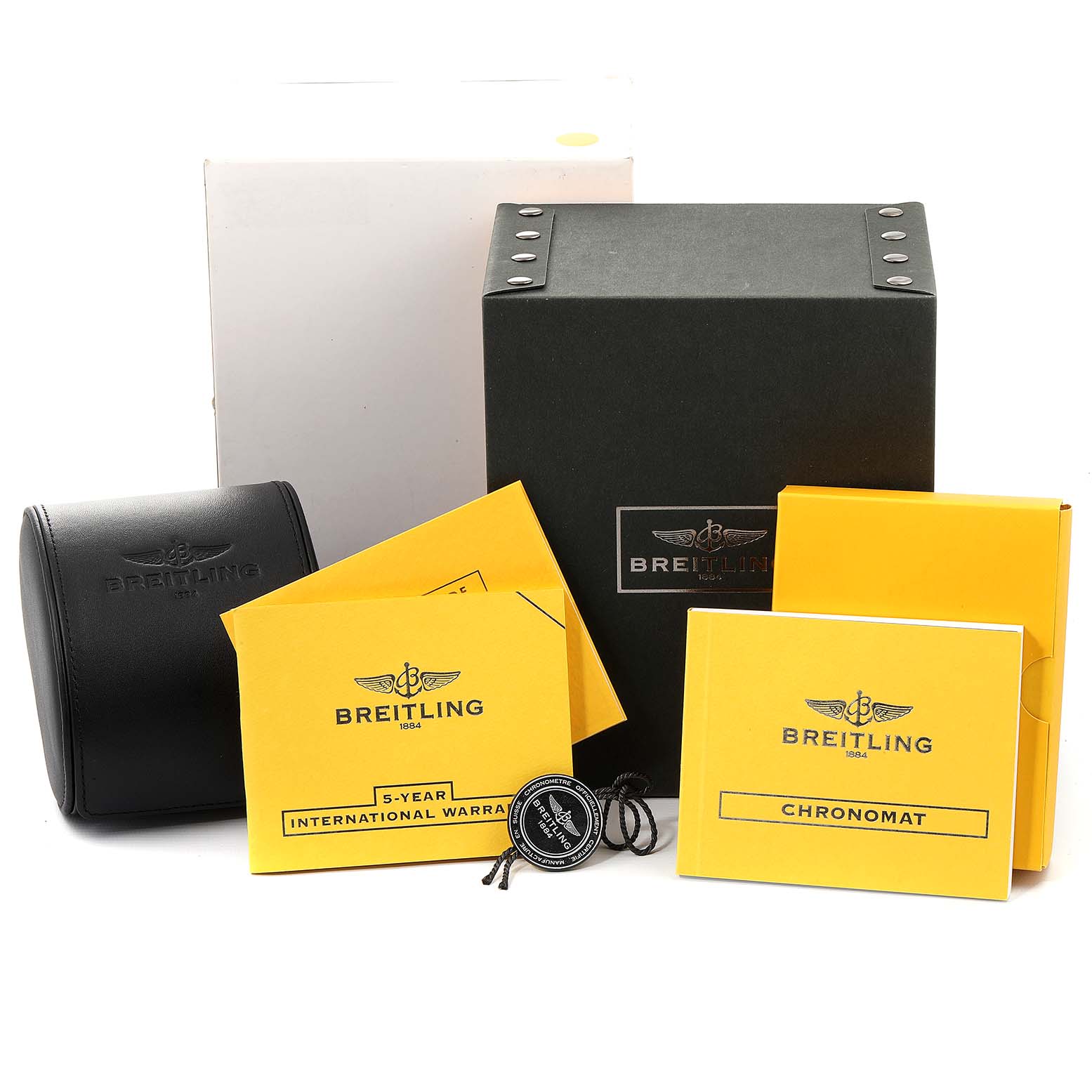 The image shows packaging and accessories for a Breitling Chronomat AB0110 Men's Stainless Steel White Dial AB0110 Men's Stainless Steel White Dial watch, including boxes, booklets, and a warranty card.