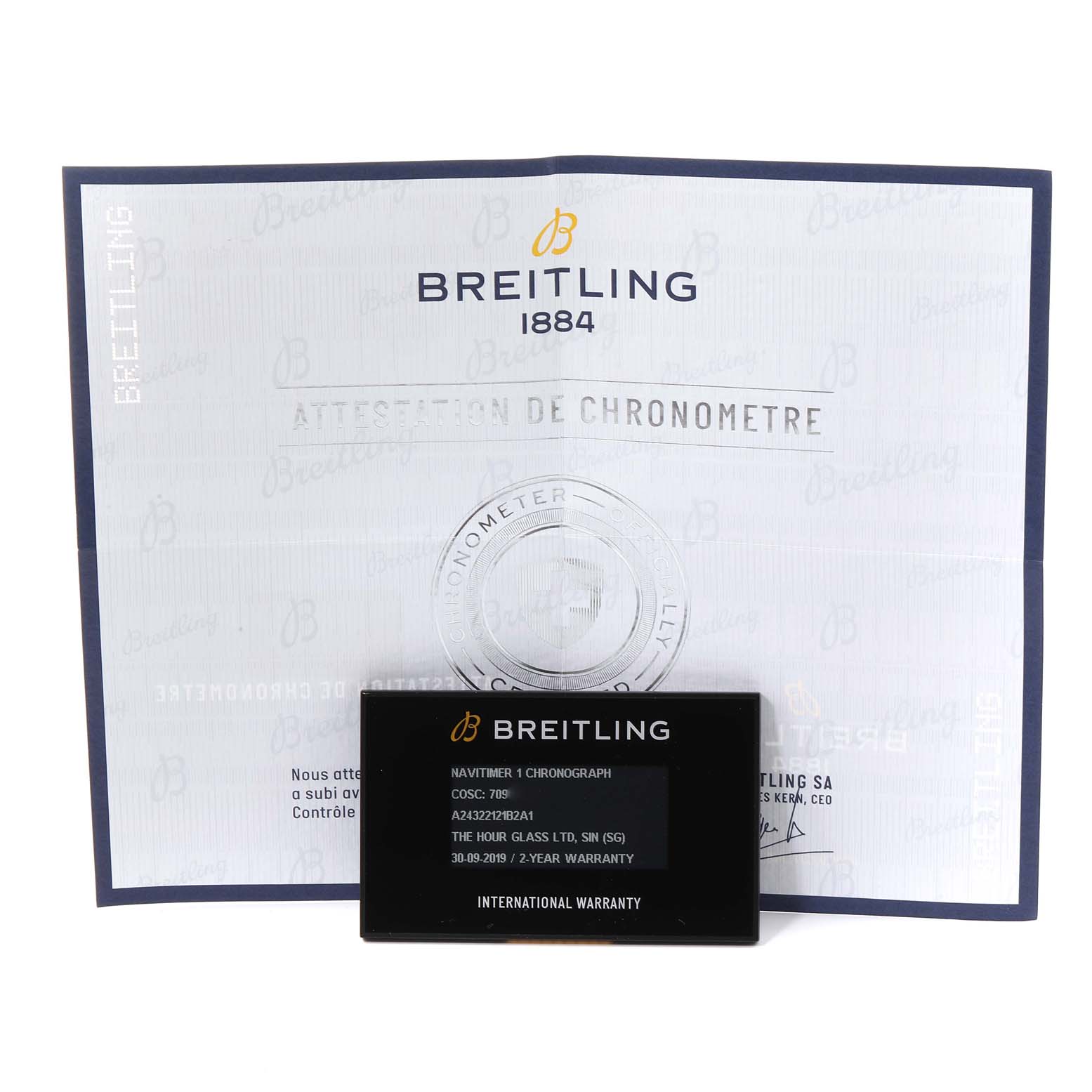 The image shows the warranty card and chronometer certificate for a Breitling Navitimer A24322 Men's Stainless Steel Black Dial A24322 Men's Stainless Steel Black Dial watch.