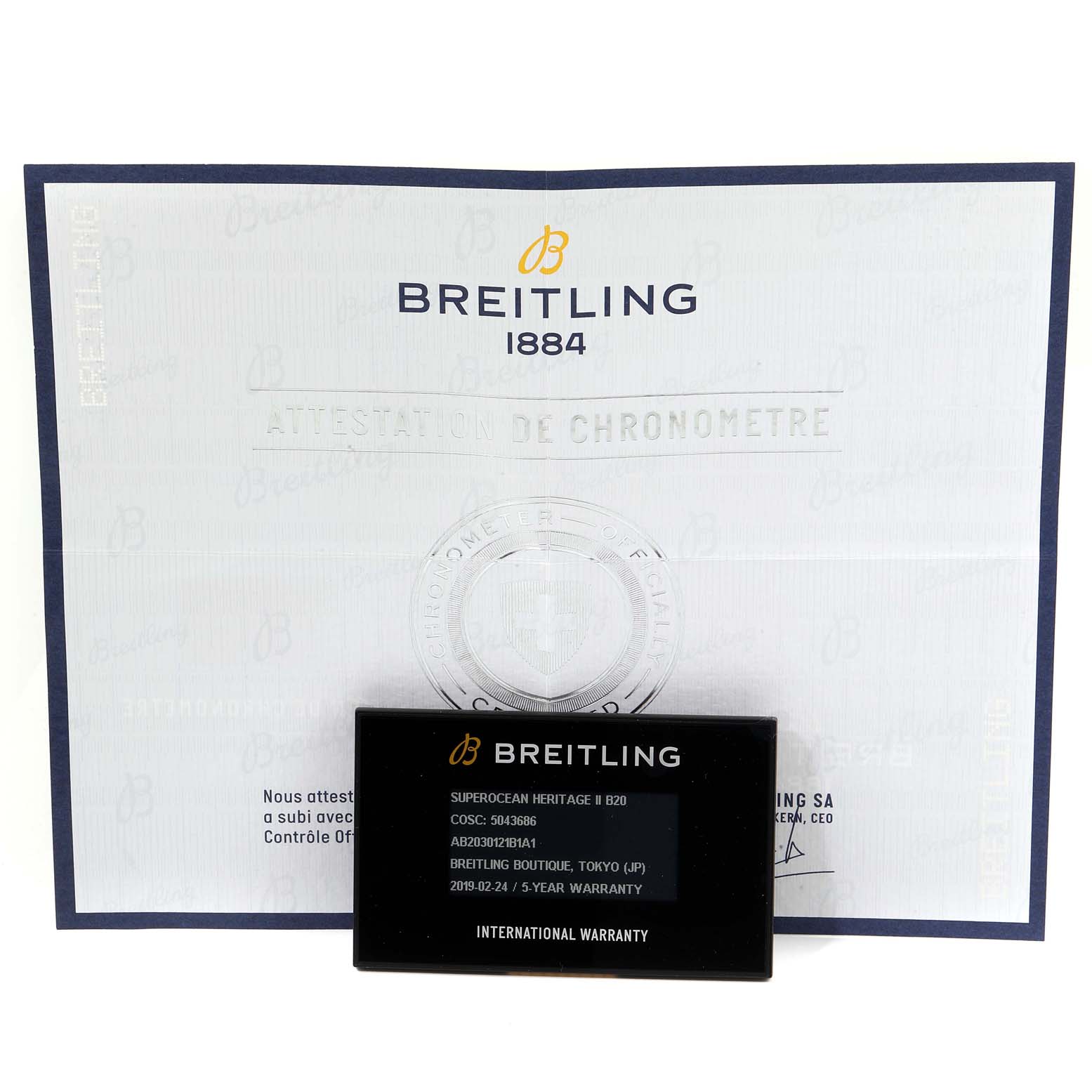 The image shows the Breitling certificate and international warranty card for the Superocean Heritage II B20 model.