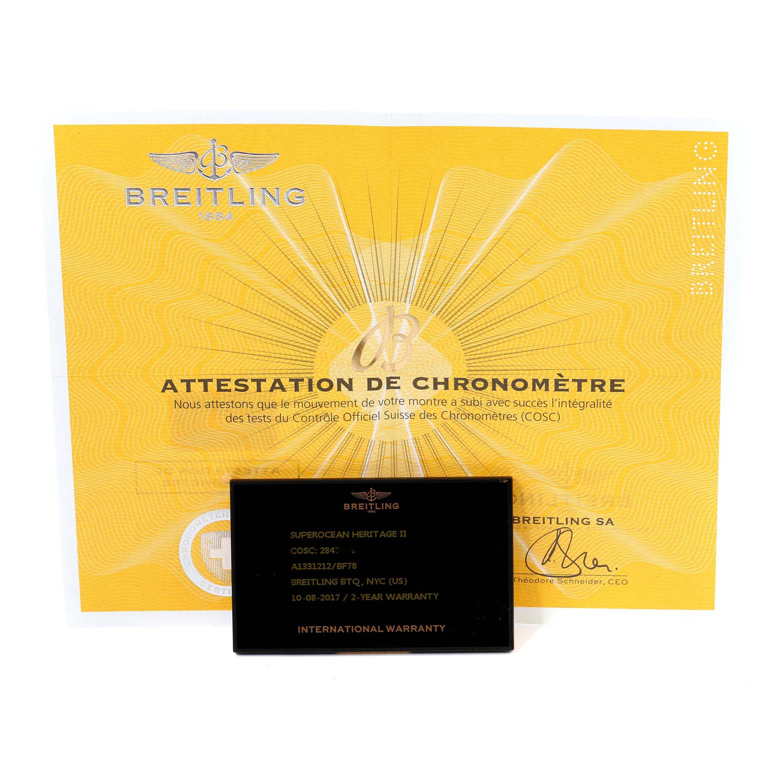 The image shows a Breitling certificate and an international warranty card for the Superocean model.