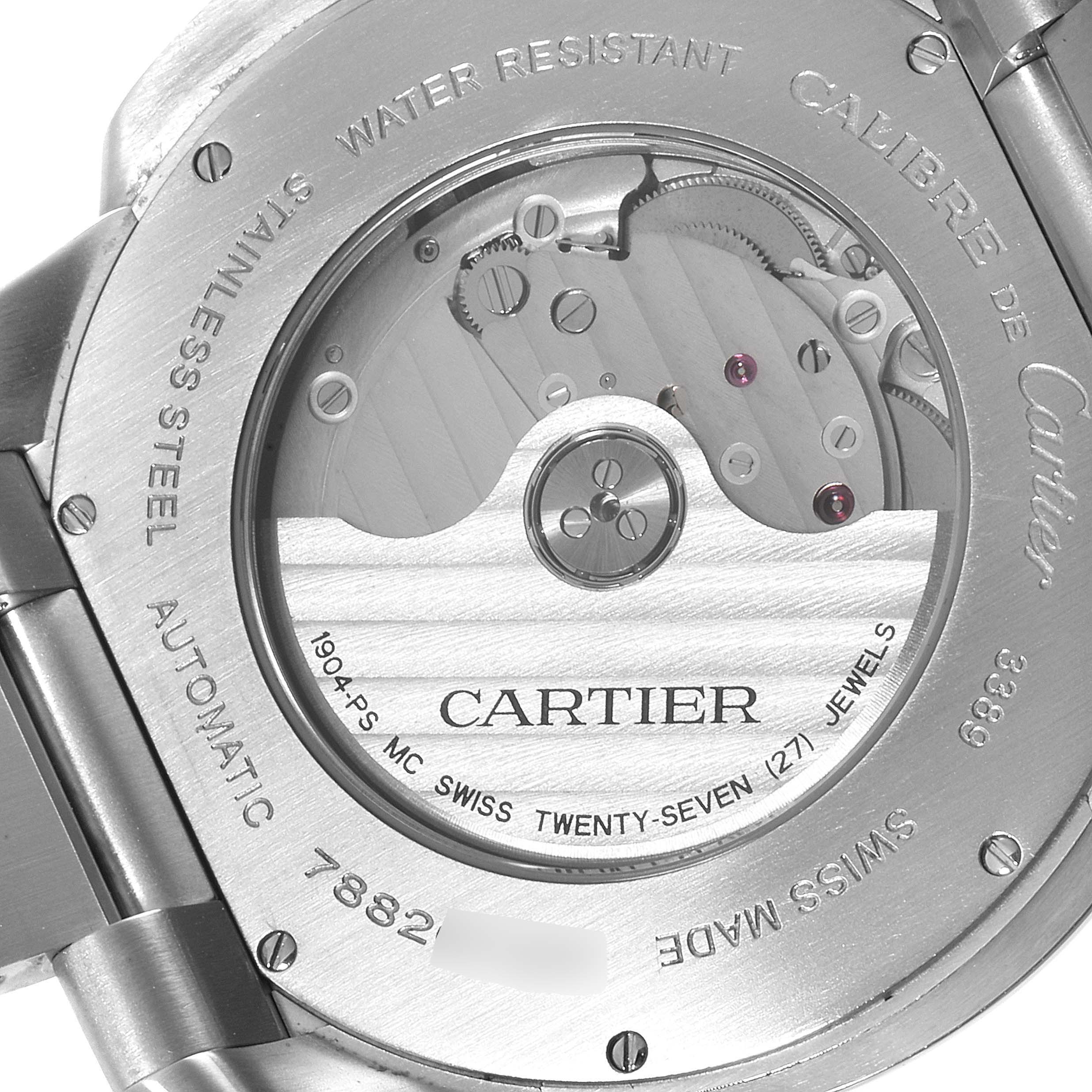 The image shows the back of a Calibre de Cartier watch by Cartier, highlighting its automatic movement and inner mechanics.