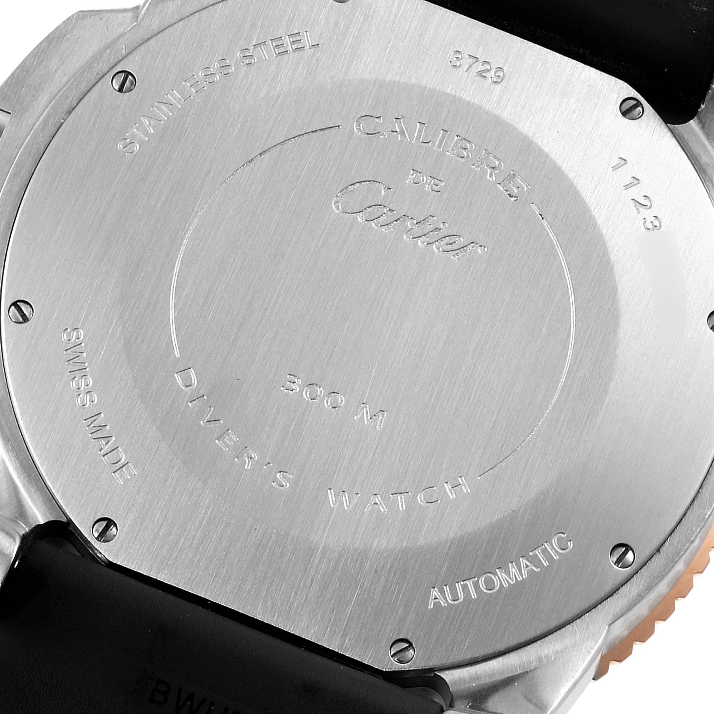 This image shows the back casing of a Calibre de Cartier watch by Cartier, highlighting its engravings and stainless steel material.