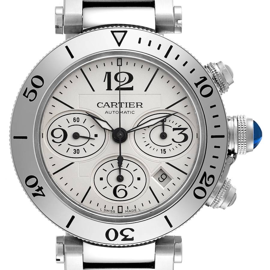 The Cartier Pasha watch is shown from the front, highlighting the dial, sub-dials, bezel, and crown with a blue cabochon.