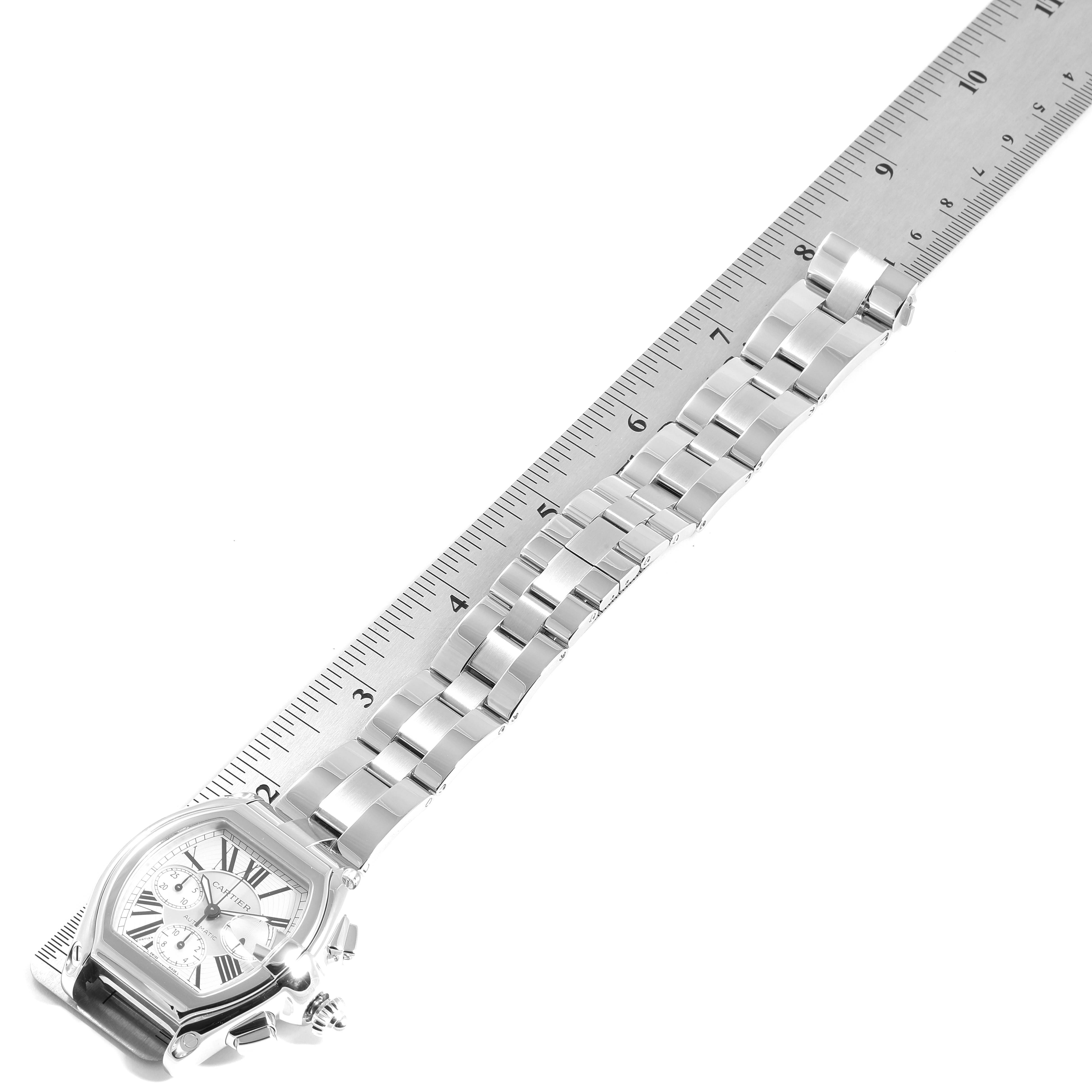 The image shows a silver bracelet of a Cartier Roadster W62019X6 Men's Stainless Steel Silver Dial W62019X6 Men's Stainless Steel Silver Dial watch, positioned along a measuring ruler.
