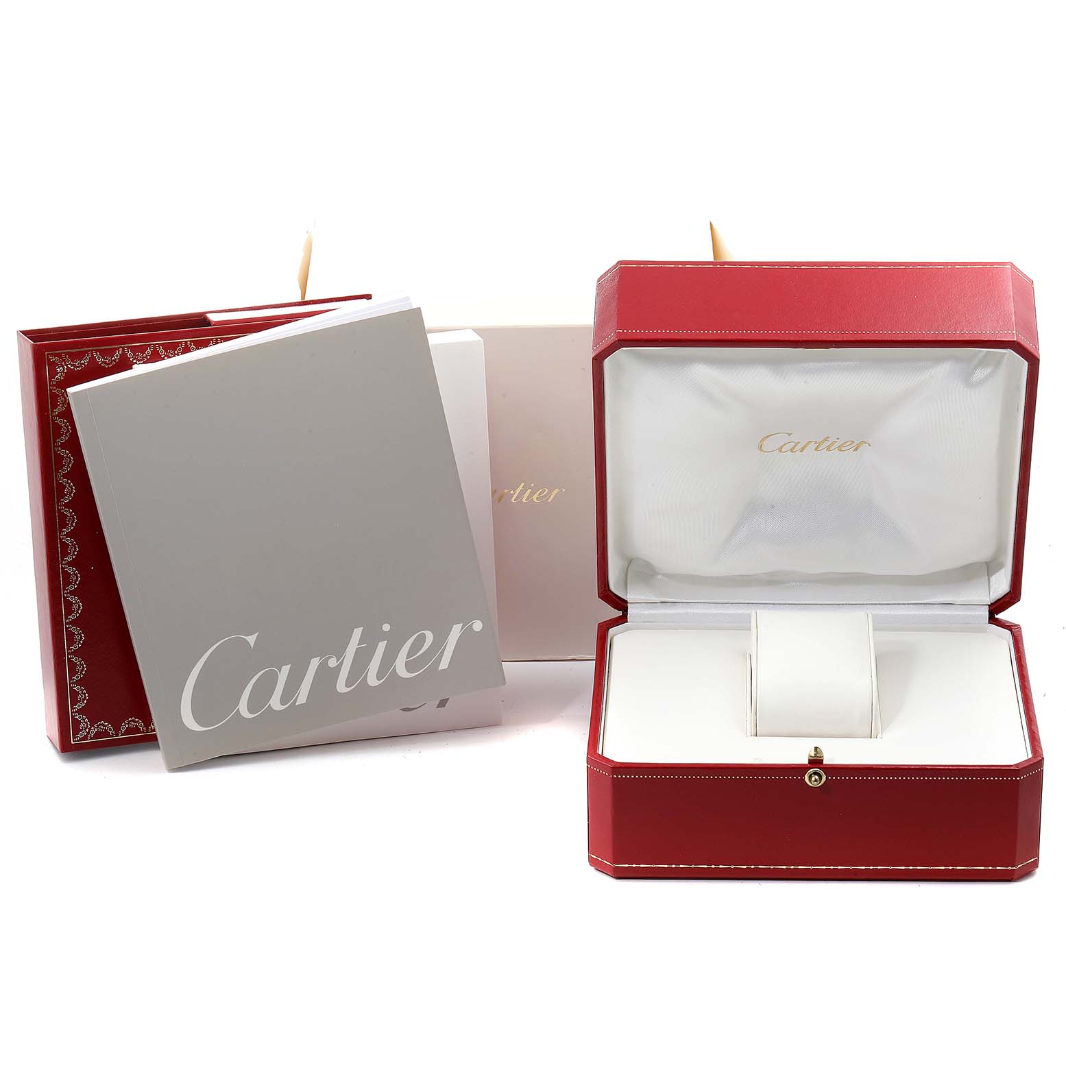 This image shows the packaging and accessories for a Cartier Tank Francaise W51011Q3 Women's Stainless Steel Silver Dial W51011Q3 Women's Stainless Steel Silver Dial watch, including the box and user manuals.