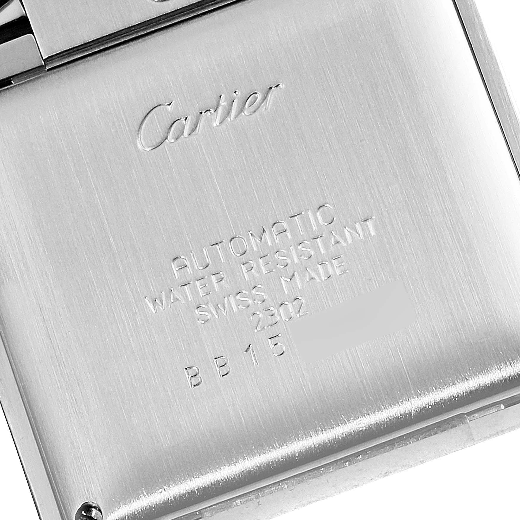 This is an angled close-up of the case back of a Cartier Tank Francaise W51005Q4 Men's Steel and Gold (two tone) Silver Dial W51005Q4 Men's Steel and Gold (two tone) Silver Dial watch, showing the brand engraving and specifications.