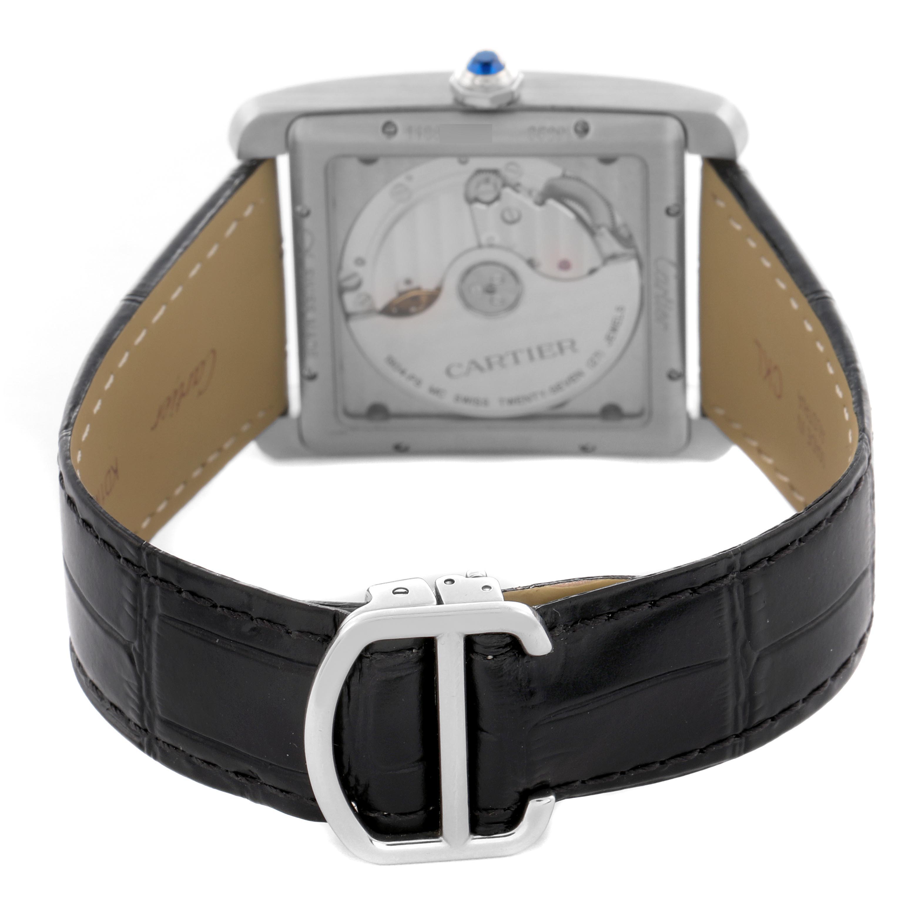 The image shows the back view of a Cartier Tank MC WSTA0010 Men
s Stainless Steel Blue Dial WSTA0010 Men
s Stainless Steel Blue Dial watch, highlighting the movement and leather strap with buckle.