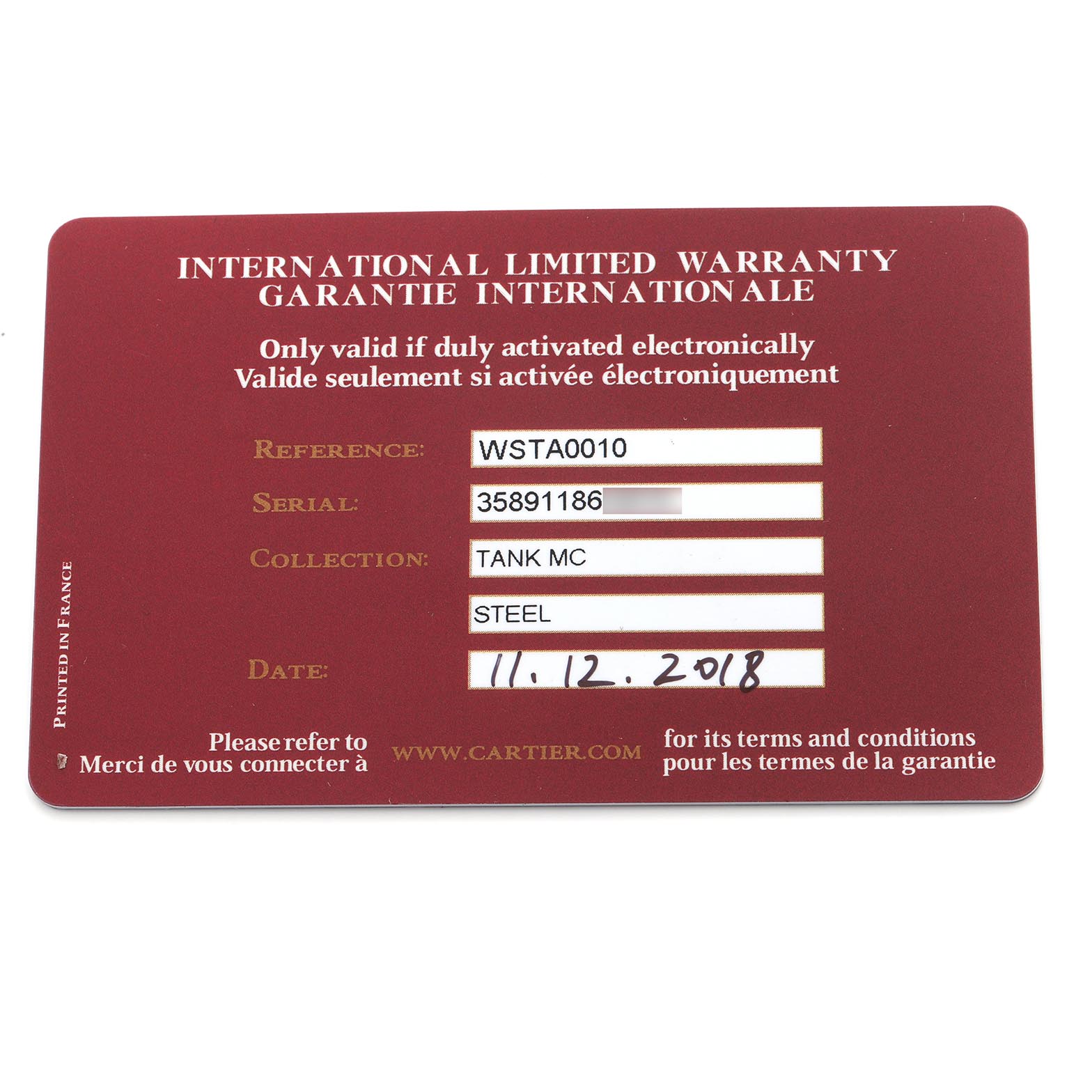 This image shows the Cartier Tank MC WSTA0010 Men
s Stainless Steel Blue Dial WSTA0010 Men
s Stainless Steel Blue Dial watch
s warranty card, displaying reference, serial, collection, material, and date details.