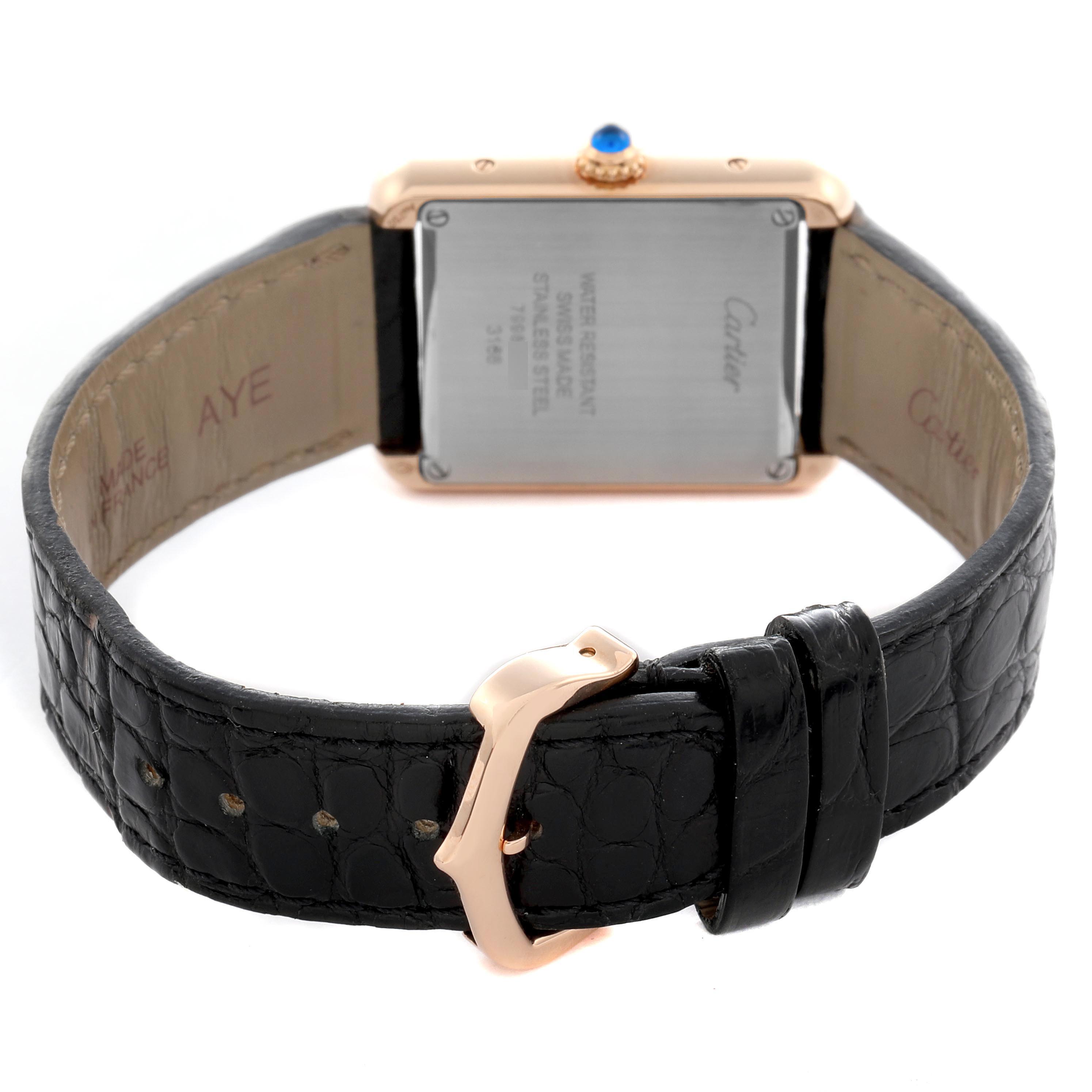 The image shows the back case and strap of the Cartier Tank Solo W5200024 Women
s Steel and Gold (two tone) Silver Dial W5200024 Women
s Steel and Gold (two tone) Silver Dial watch, including the buckle and crown with a blue cabochon.