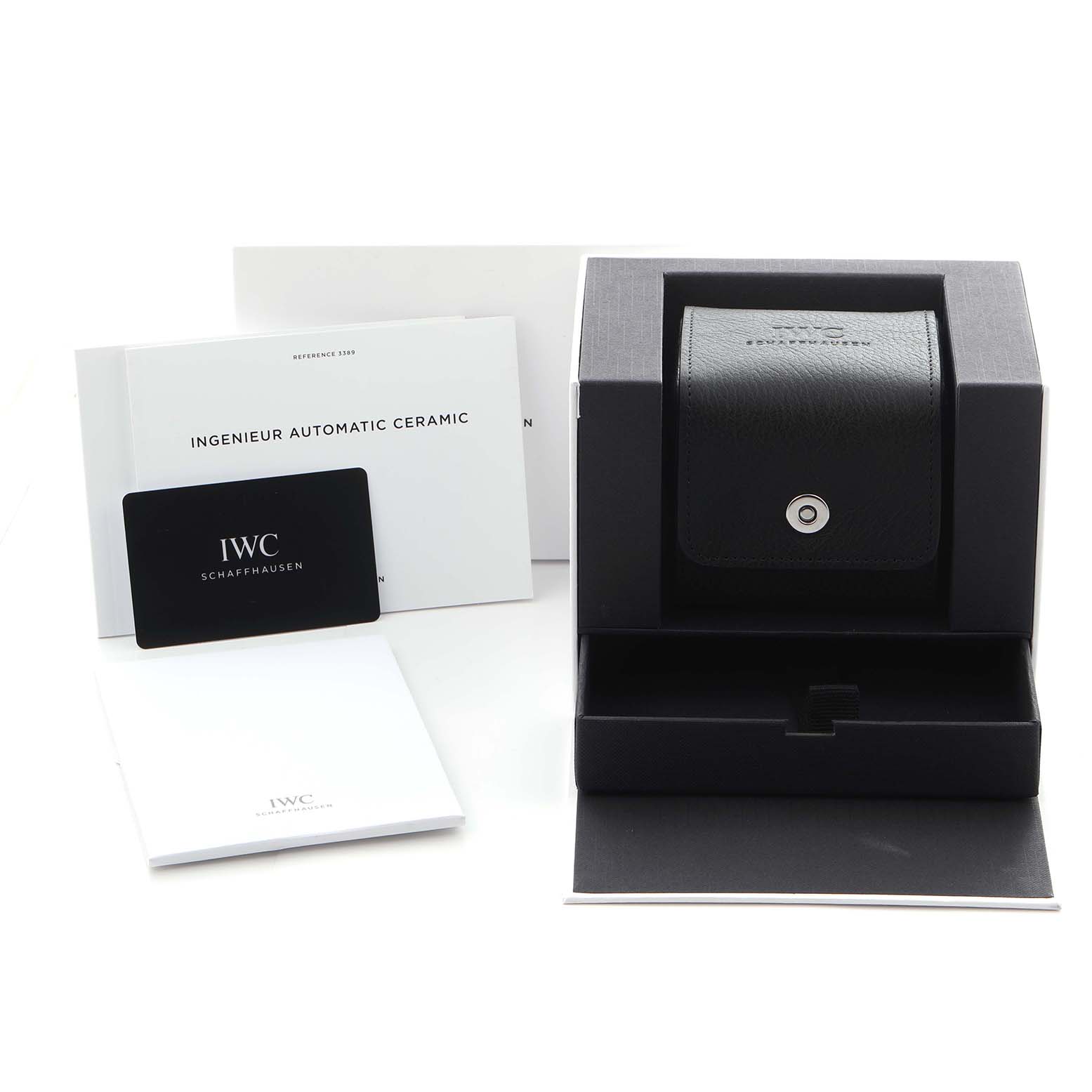 The image shows an IWC Ingenieur IW338903 Men
s Ceramic Black Dial IW338903 Men
s Ceramic Black Dial watch box, warranty card, and manuals, with the watch case prominently displayed.