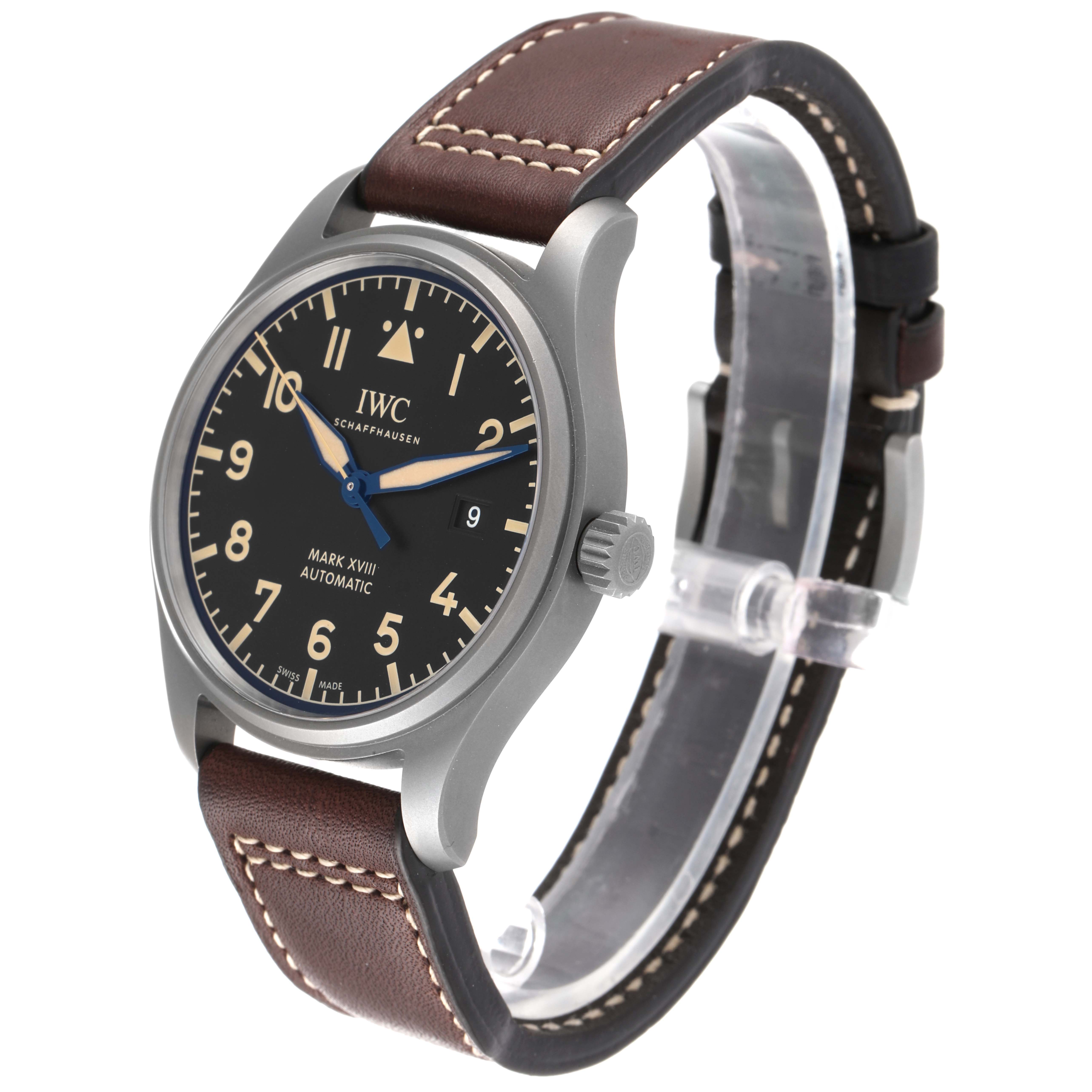 The IWC Pilot IW327006 Men's Titanium Black Dial IW327006 Men's Titanium Black Dial Mark XVIII Automatic watch is shown at a front-side angle showcasing the face, brown leather strap, and crown.
