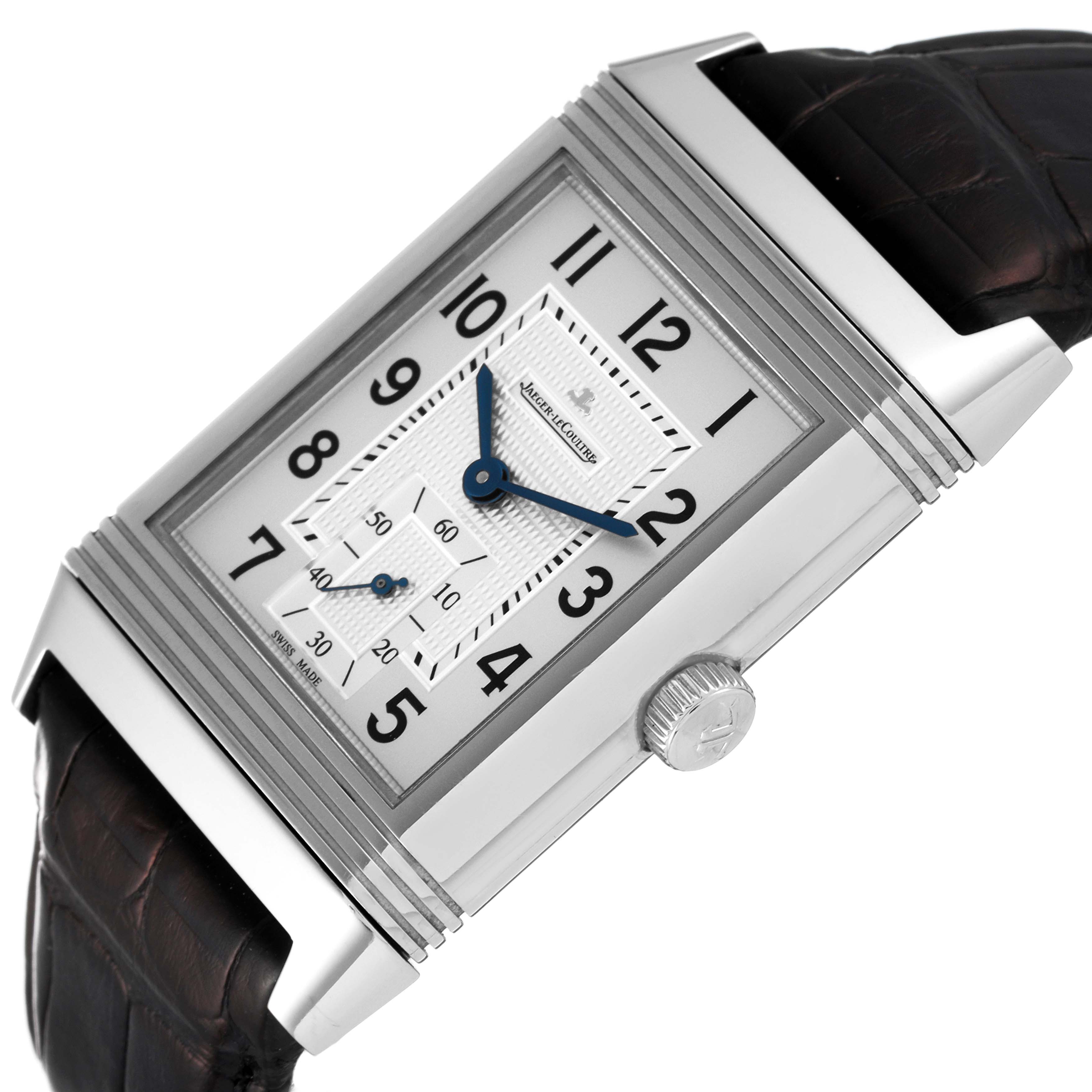 This image shows a Jaeger LeCoultre Reverso Q3738420 Men's Stainless Steel Silver Dial Q3738420 Men's Stainless Steel Silver Dial watch at an angled side view, highlighting the dial, crown, and strap.