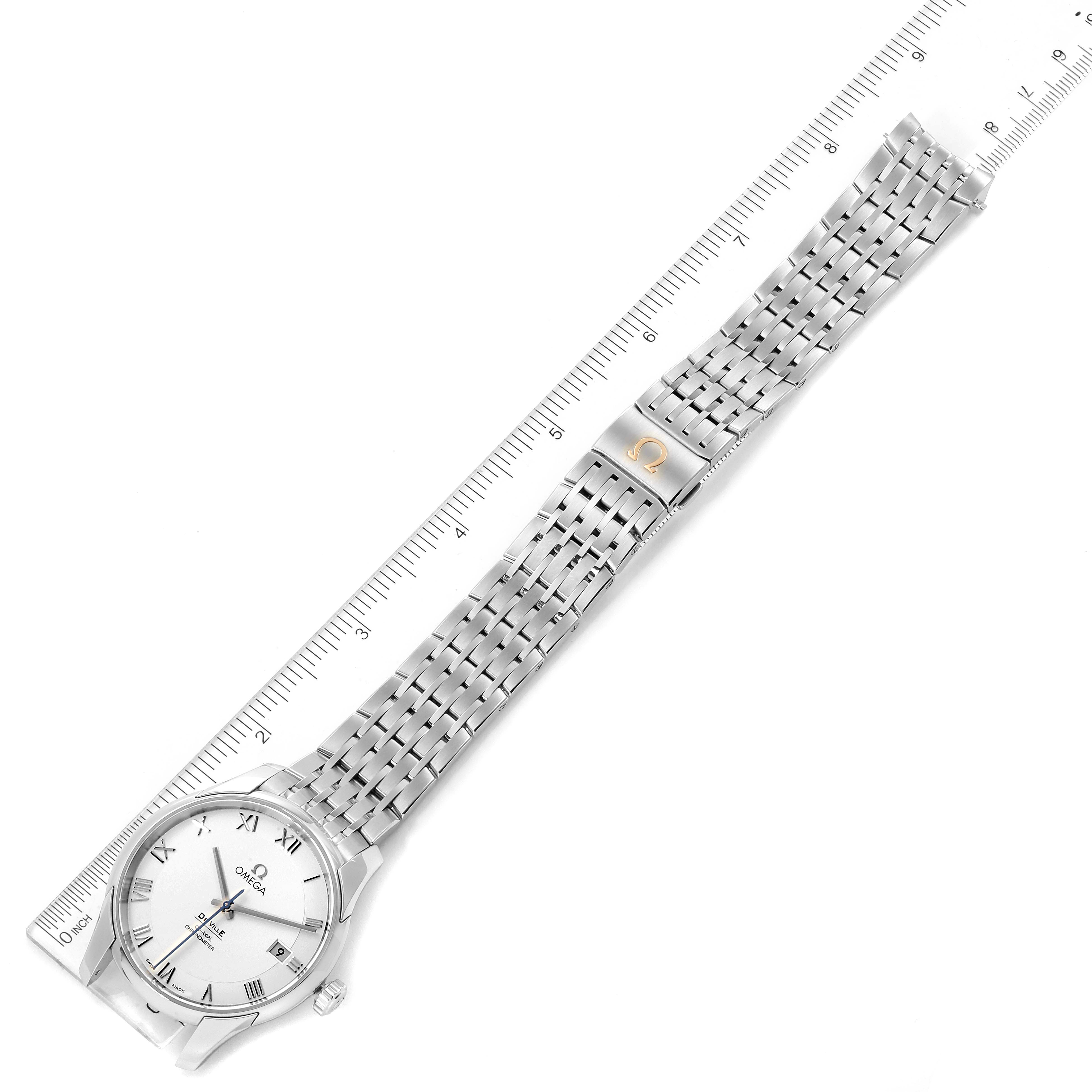 The image shows a top-down view of the Omega De Ville 431.10.41.21.02.001 Men's Stainless Steel Silver Dial 431.10.41.21.02.001 Men's Stainless Steel Silver Dial watch, displaying the face, strap, and clasp with a ruler alongside.